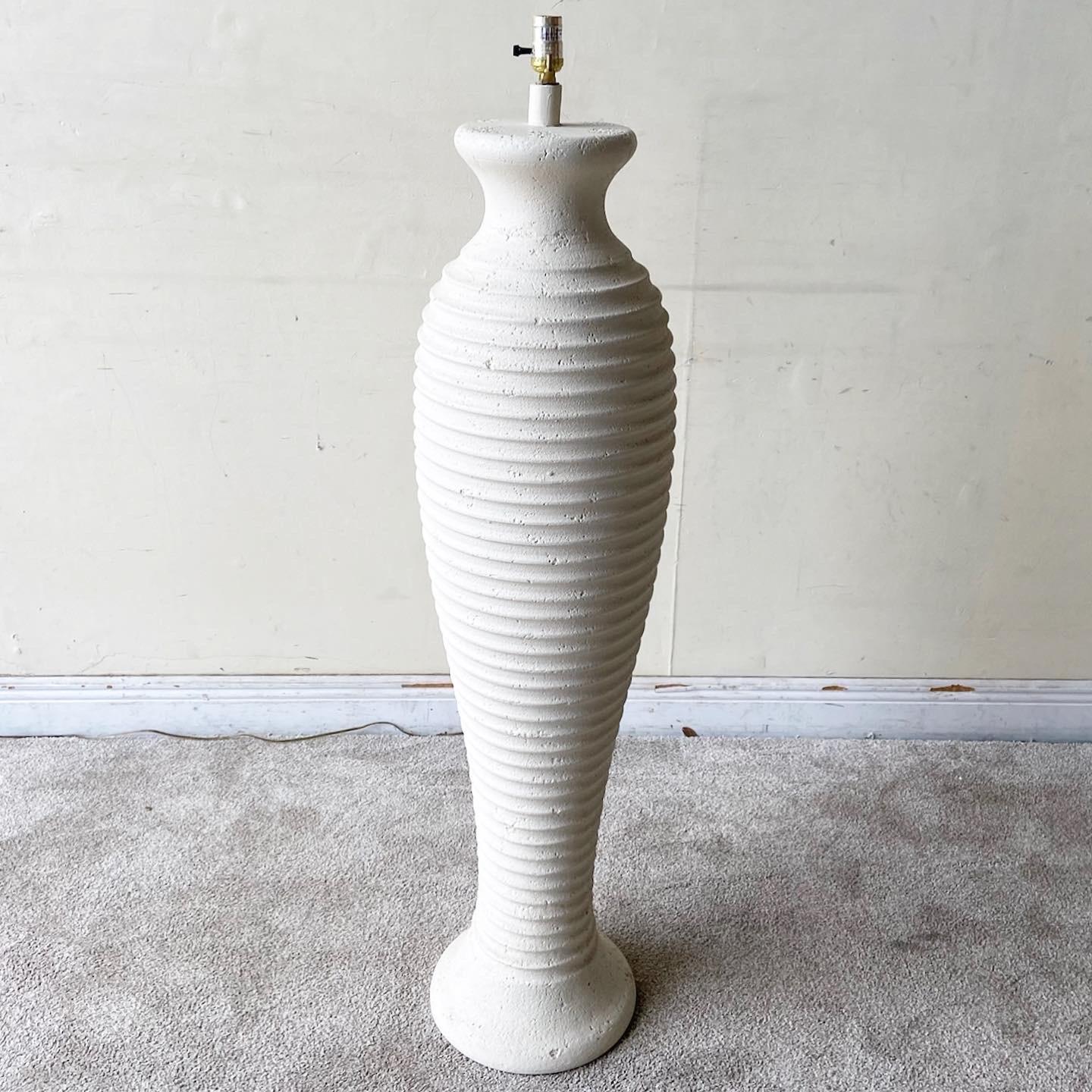 Exceptional vintage 1980s Postmodern ceramic floor lamp. Features an off white ribbed body.