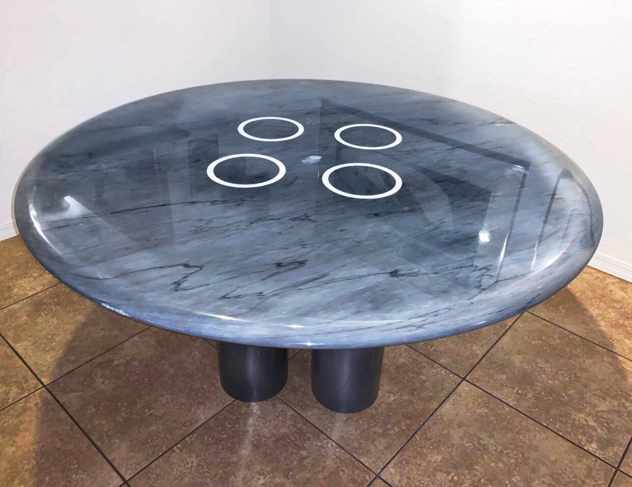 Postmodern Roche Bobois Italian modern round dining table Angelo Mangiarotti

Gorgeous burnished steel blue or grey marble, rounded edge, four central columnar supports. 1980s Roche Bobois. MSRP in the 1980s was over 8,000 USD. Single owner.