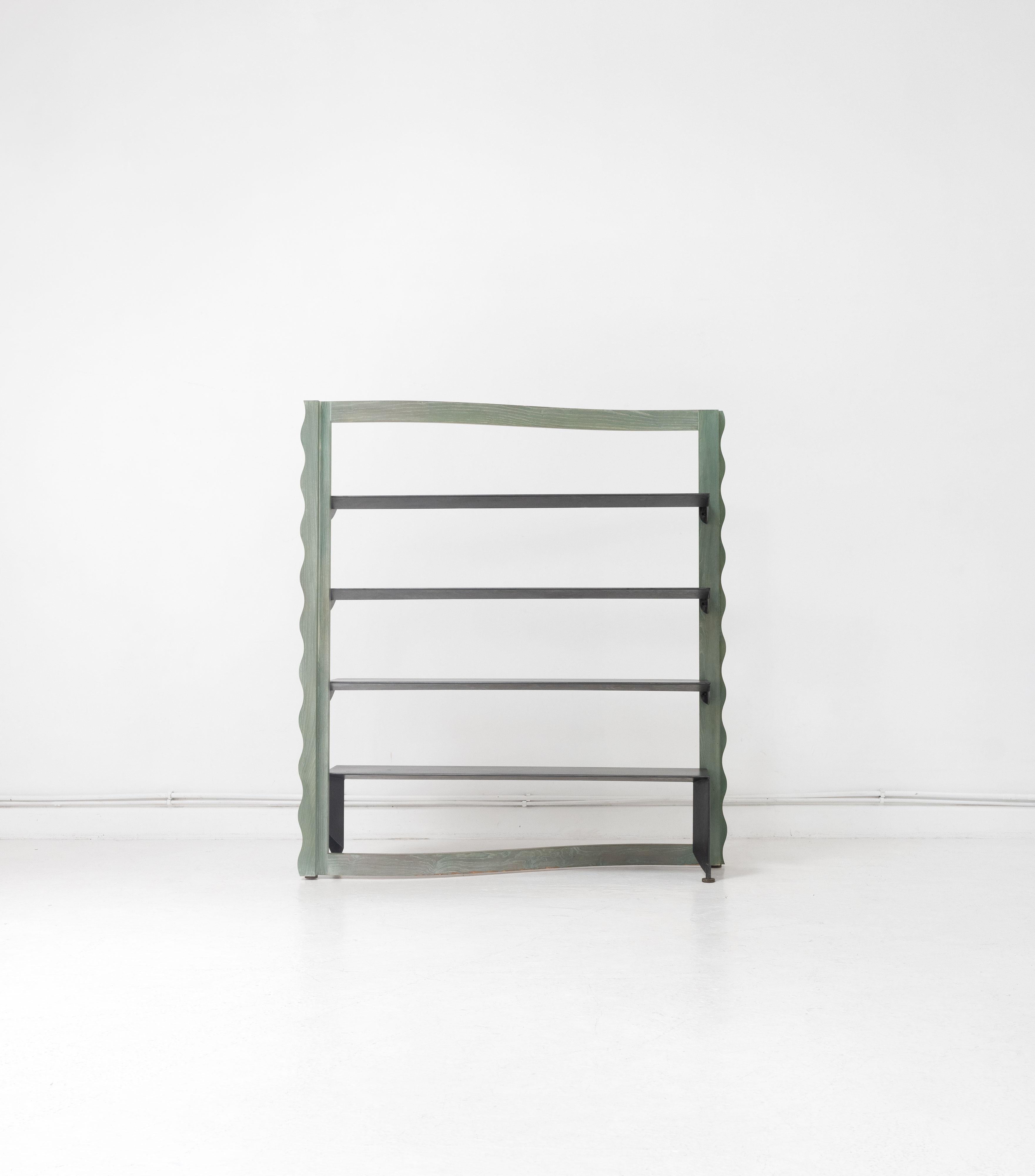 A late 20th Century shelving unit. Composed from a cerused oak frame and removable black steel shelves. Unattributed but potentially Italian taking influence from Memphis Milano. 