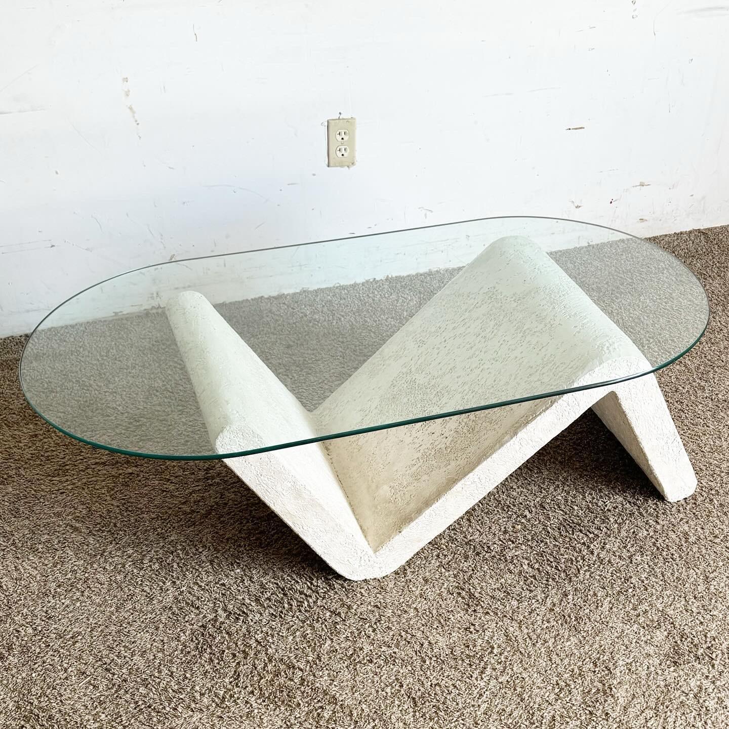 Elevate your decor with this Postmodern Sculpted Concrete Oval Glass Top Coffee Table. A perfect blend of art and function, it's a statement piece for contemporary spaces.