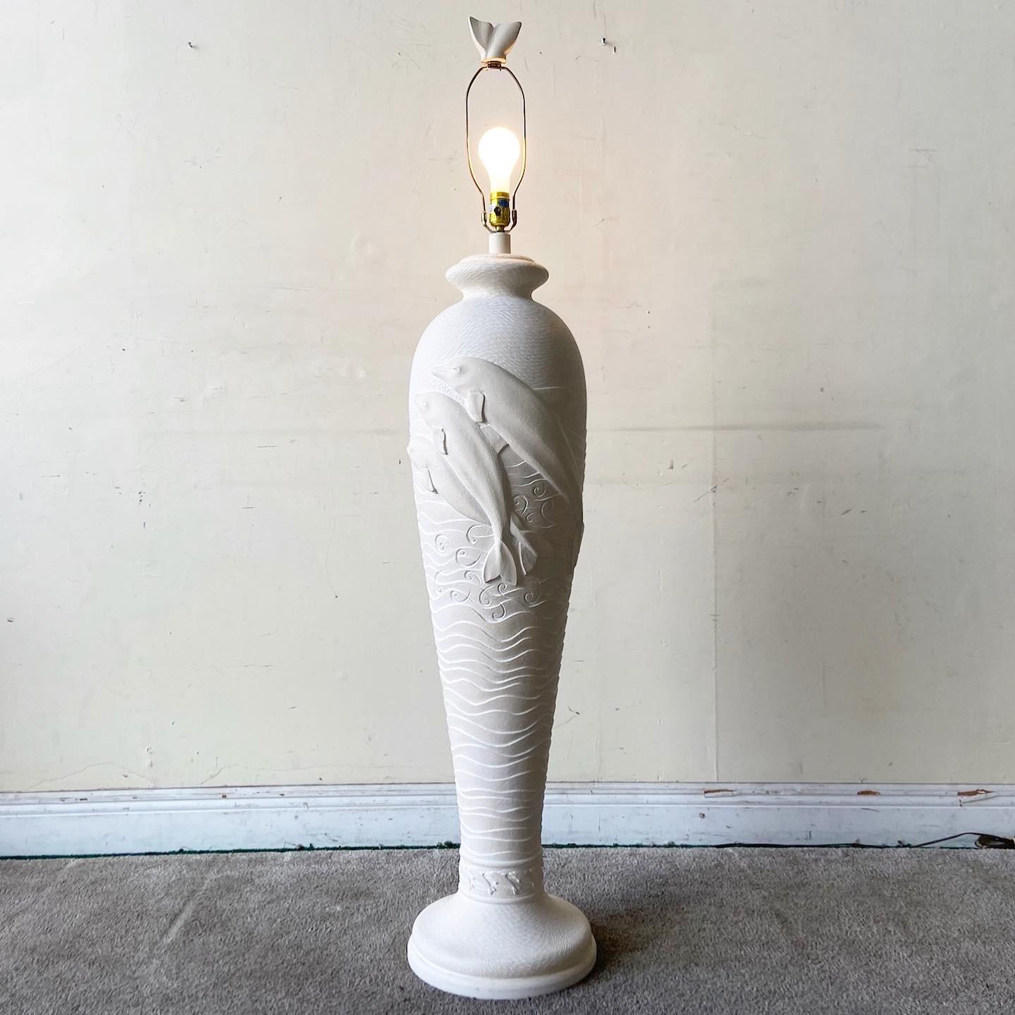 Incredible postmodern ceramic floor lamps. Features a sculpted display of dolphins around the body of the lamp.

Additional information:
Materials: Ceramic, Sculpting
Color: Beige
Style: Postmodern
Time Period: 1980s
Place of Origin: USA
Dimensions: