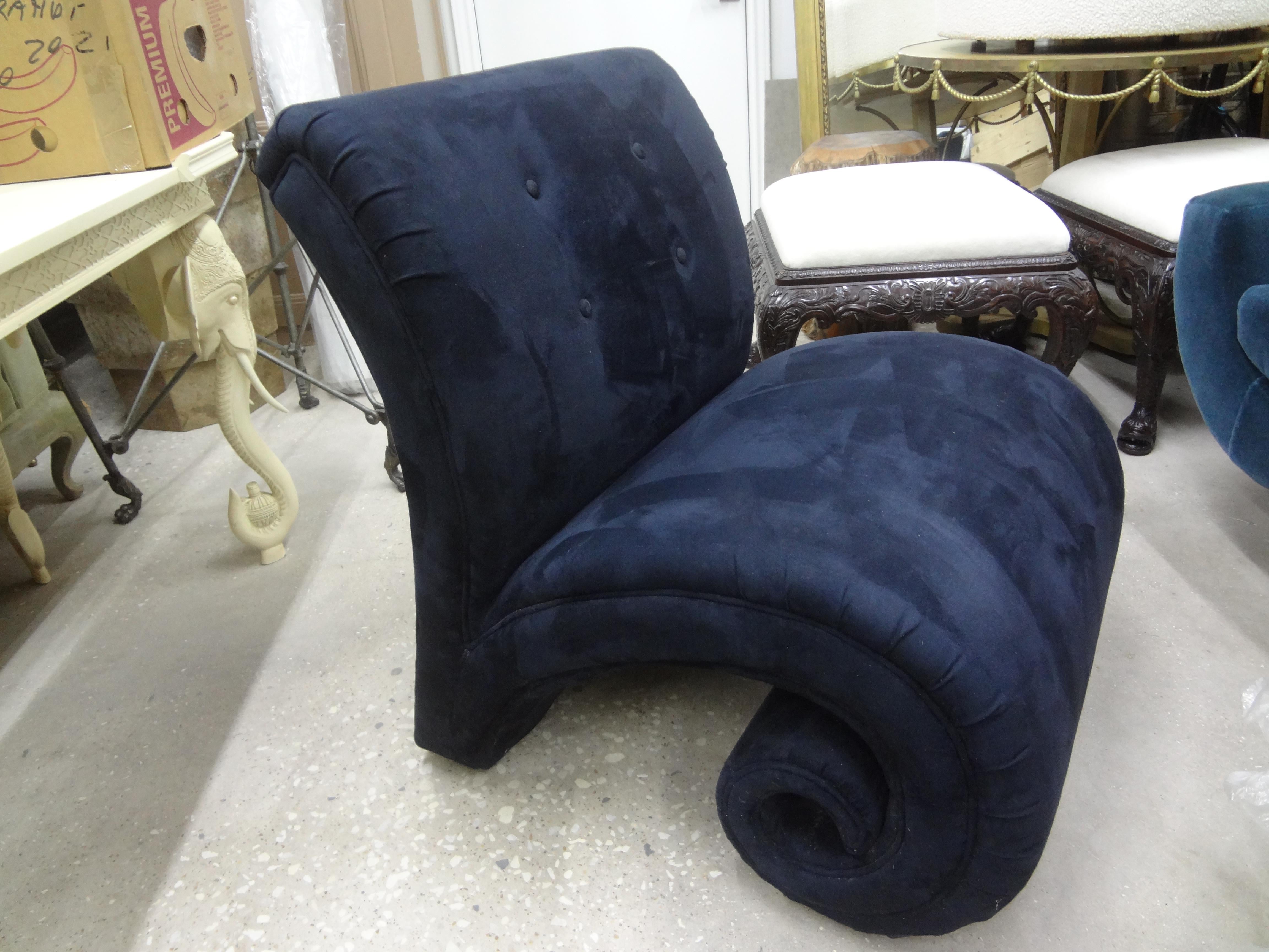Postmodern sculptural scroll lounge chair. This stunning modernist lounge chair which terminates in an interesting scroll or curl design is extremely comfortable and beautiful from every angle. Currently in its original navy blue ultrasuede fabric