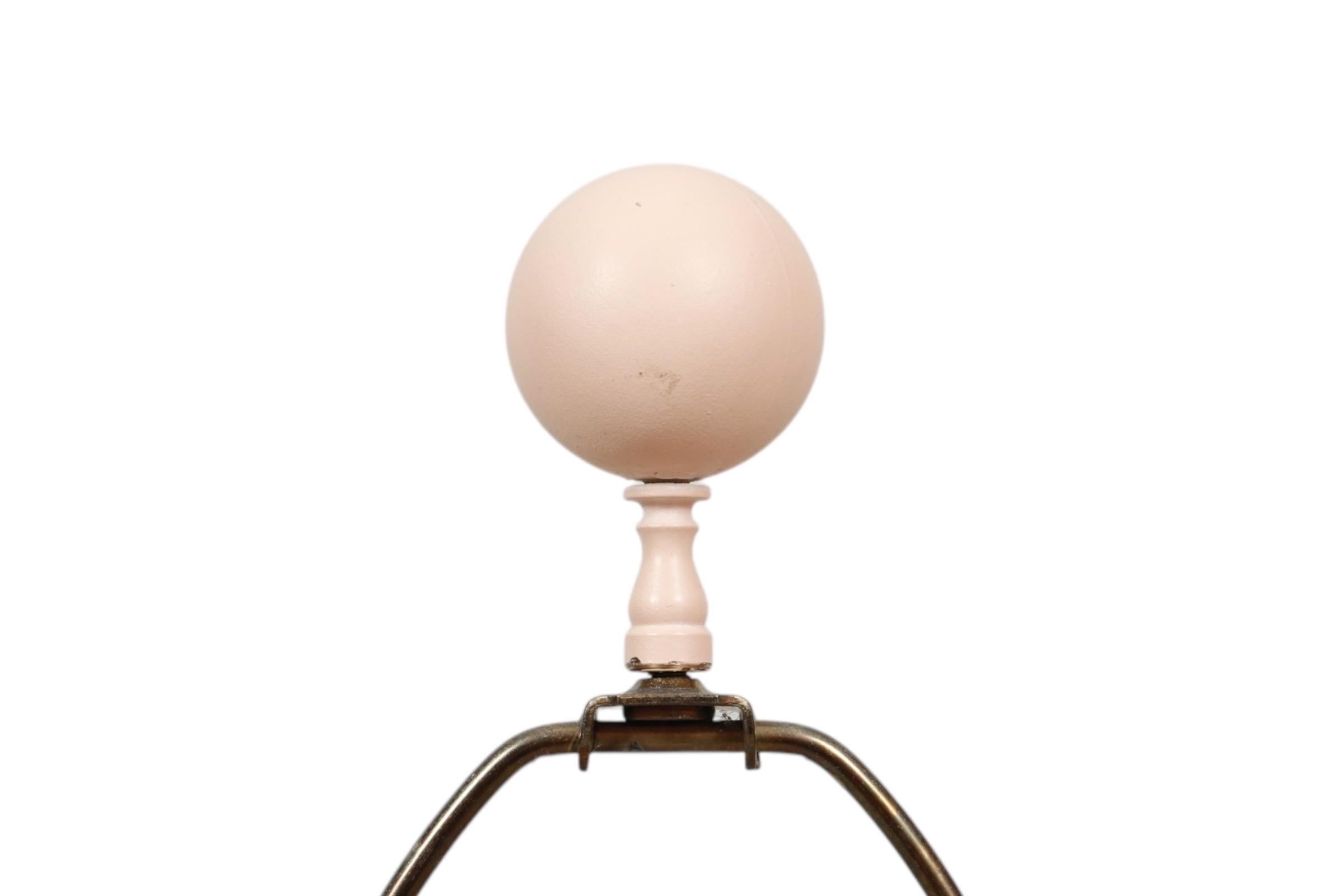 A pair of postmodern lamps by Pacific Coast dated 1991. Postmodern sculptural style vases in peach are cast with flowing folds draped to give the look of fabric. Both the table lamp and the floor lamp come with matching peach ball finials, and are
