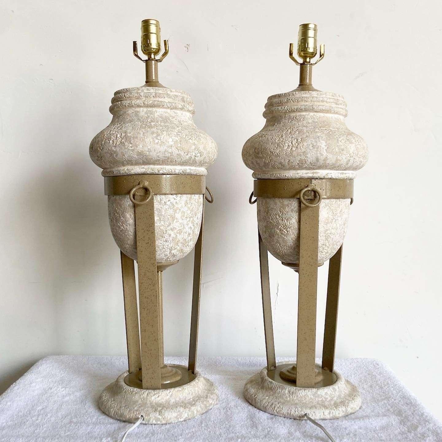 Exceptional pair of postmodern ceramic and metal table lamps. Each feature an almost Roman aesthetic with a porous plaster resting in a metal frame. 