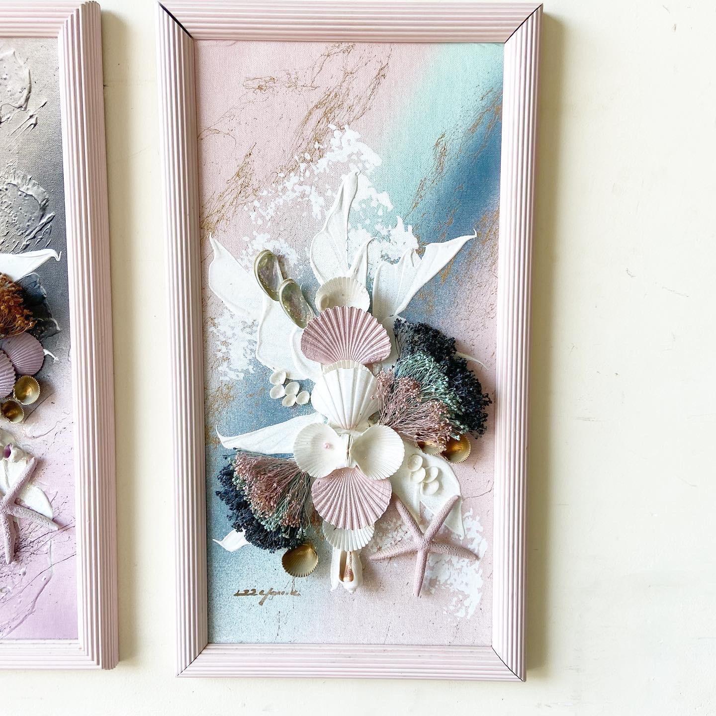 Amazing pair of framed and signed seashell art. Purple and blue painted onto the canvas.
