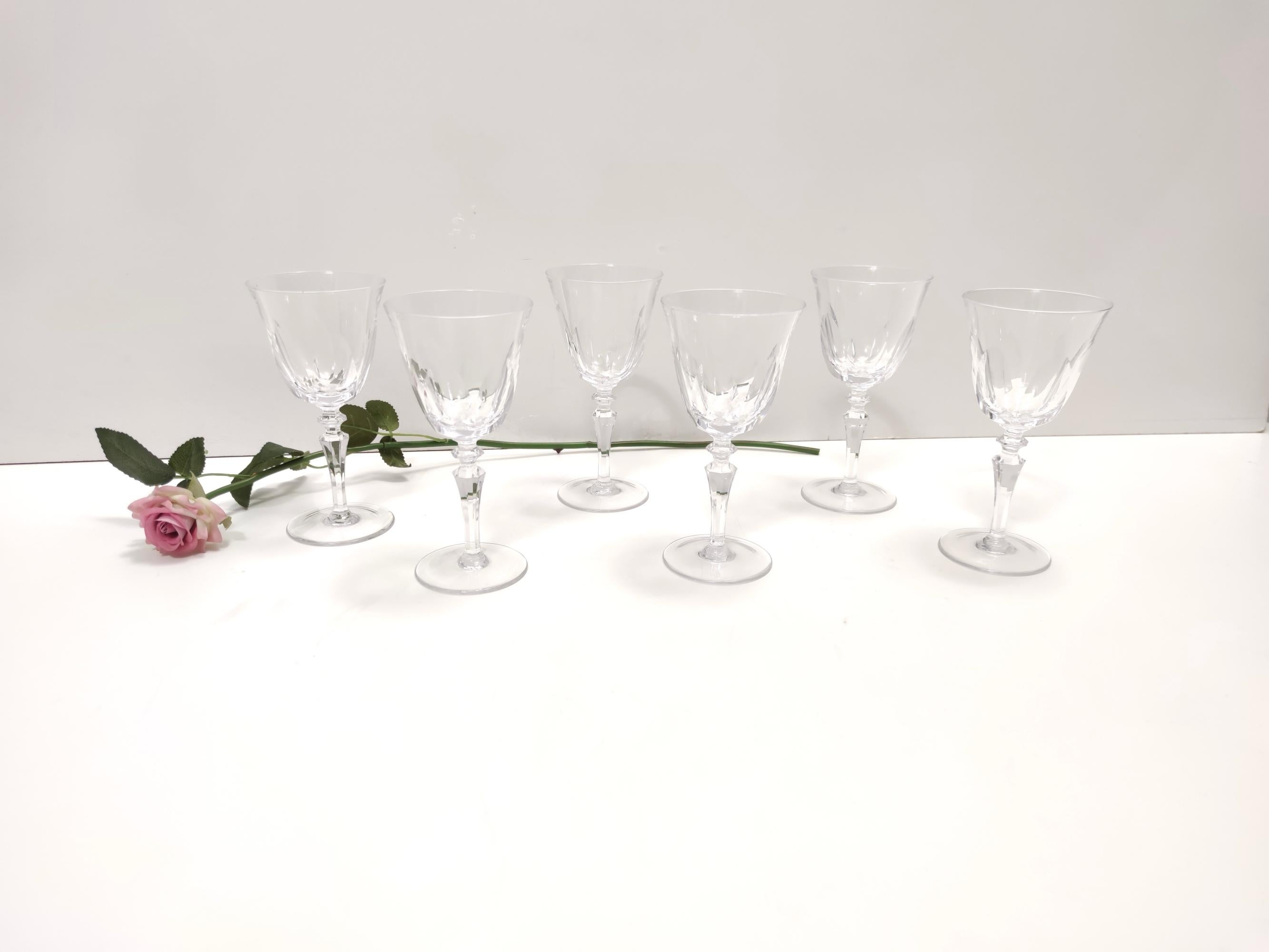 Made in France by Baccarat, 1960s.
These five coupes are made in thin crystal.
They are vintage, therefore they might show slight traces of use, but they can be considered as in perfect original condition and ready to become a piece in a home. 
One