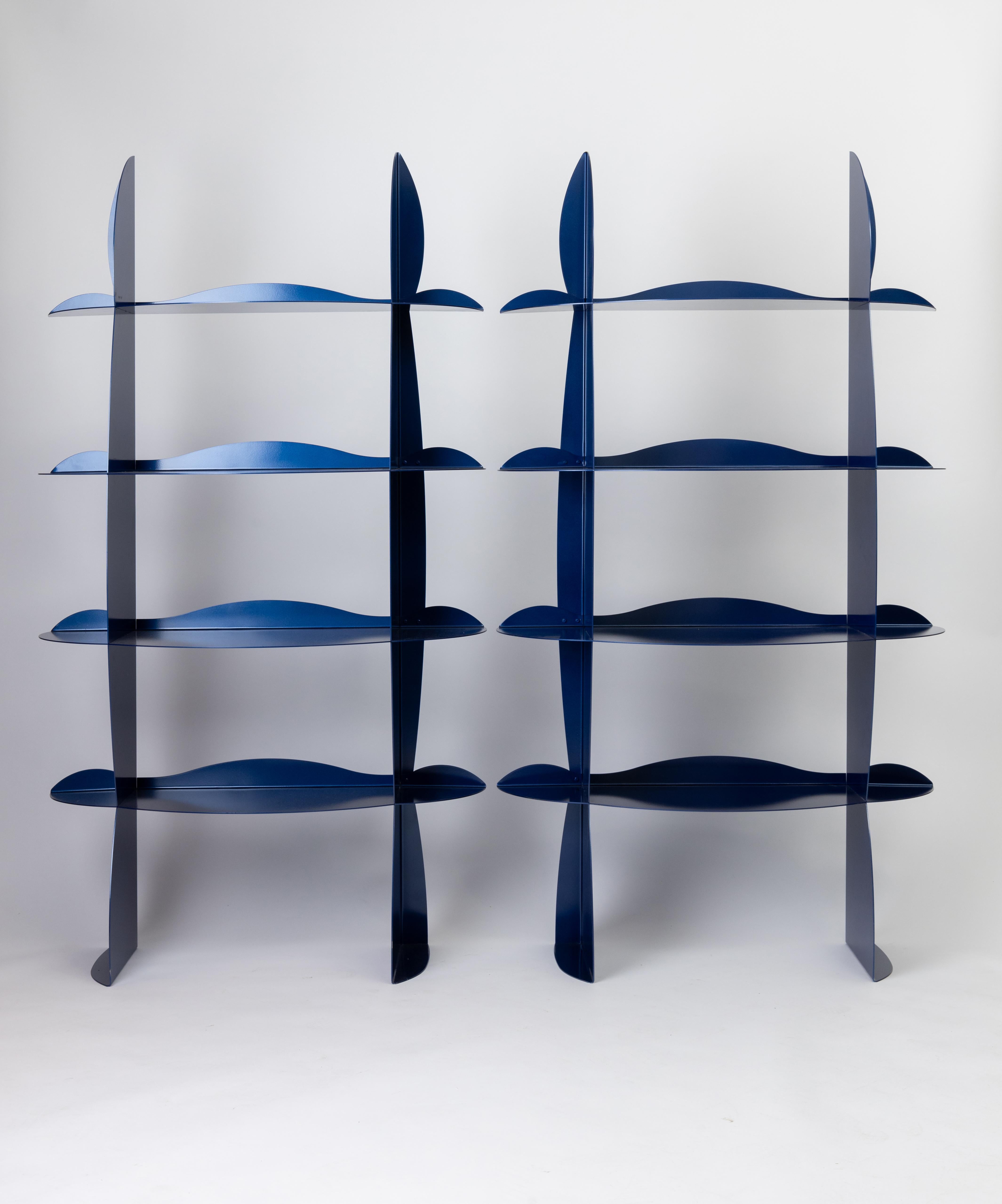 Postmodern shelving units made of painted steel. 
Unknown designer

set of 2 
