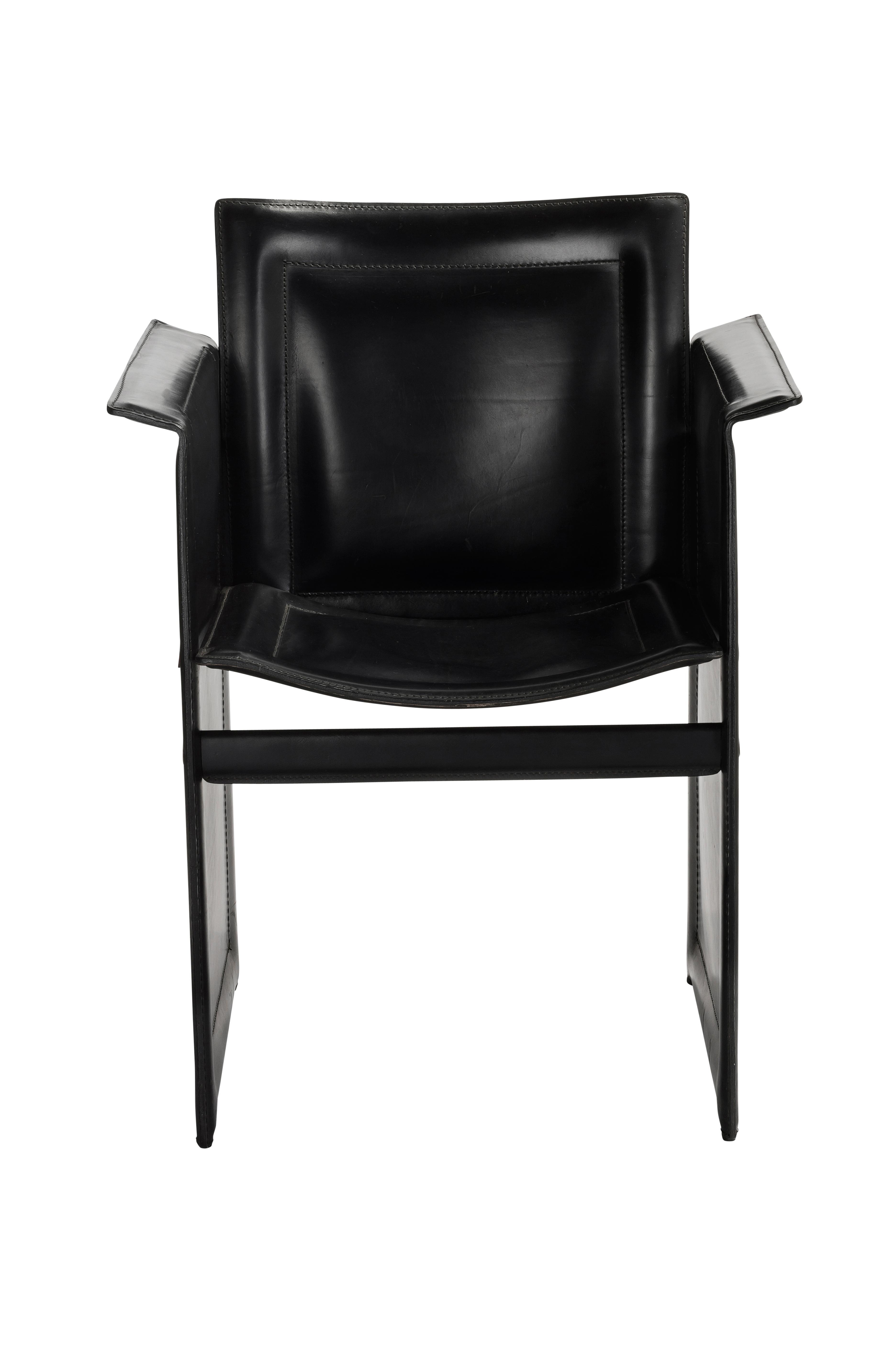 Iconic 1980s chair by Italian manufacturer Arrben in black leather, based on a design by Tito Agnoli. This comfortable and stylish Postmodern chair is beautifully designed in Minimalist fashion and the leather expertly crafted.