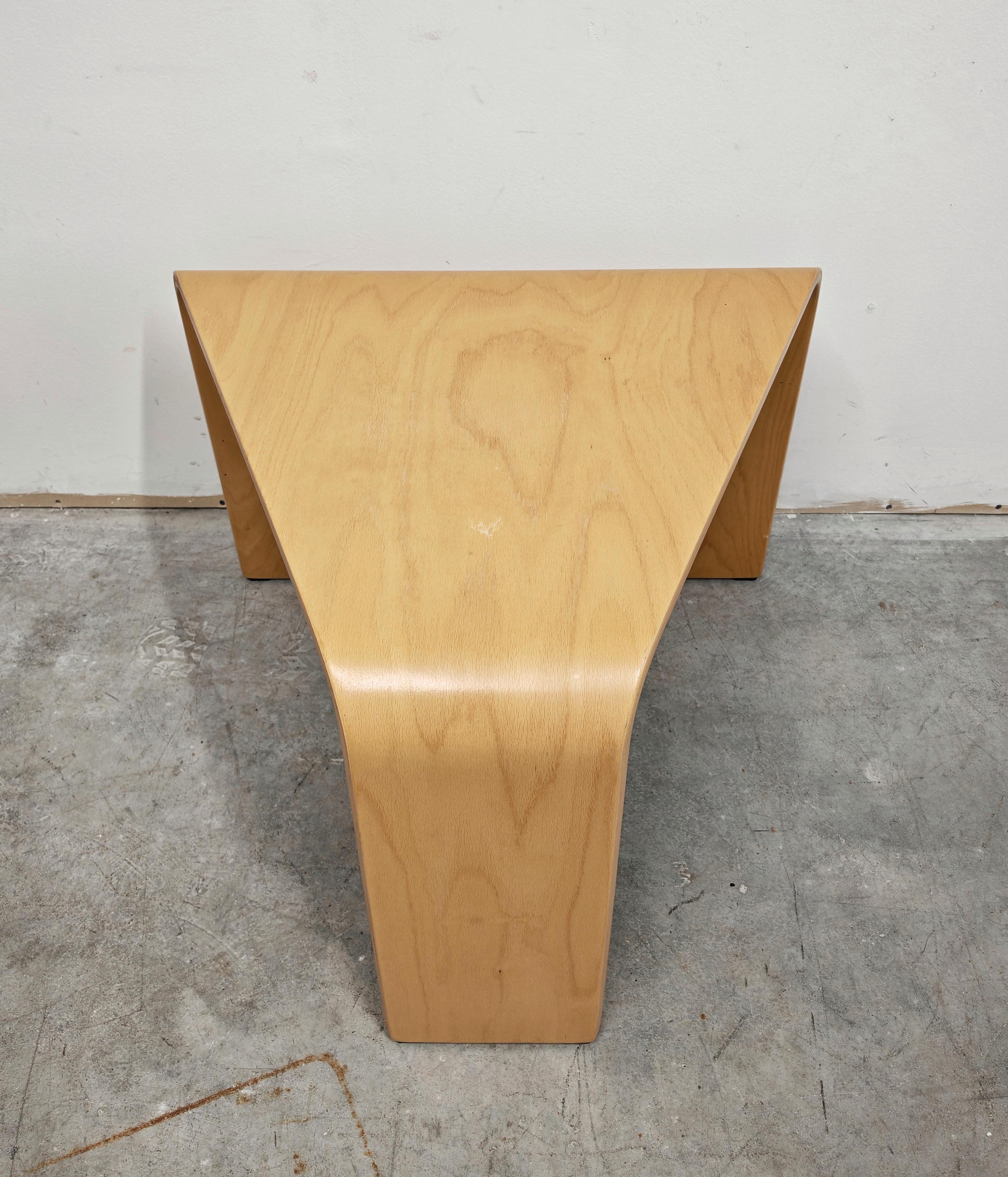 In this losting you will find a sleek, playful triangle side table by Ekornes and their Stressless line. Crafted out of beechwood in a lovely warm light wood color. Excellent quality, featuring a compact design and unique 3D triangle shape. Chic and