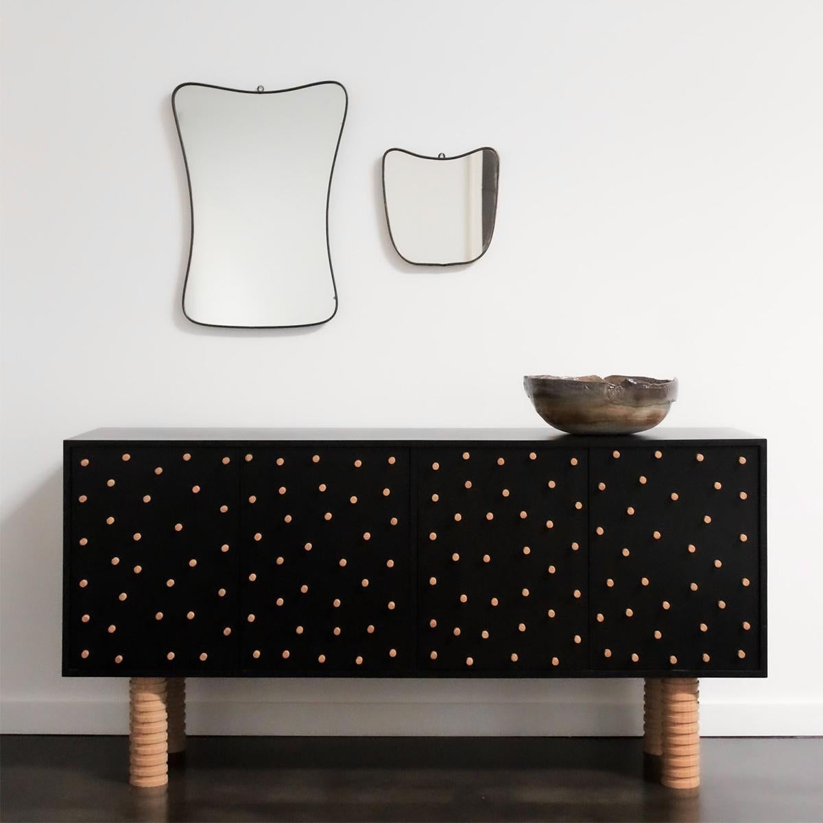 This handmade Postmodern / Brutalist Sideboard by Reeves Art + Design, a family-owned Houston, TX based art gallery, is crafted in oak and ebonized oak. The oak construction features hand carved legs and a 1/2” peg detail that protrudes on all four