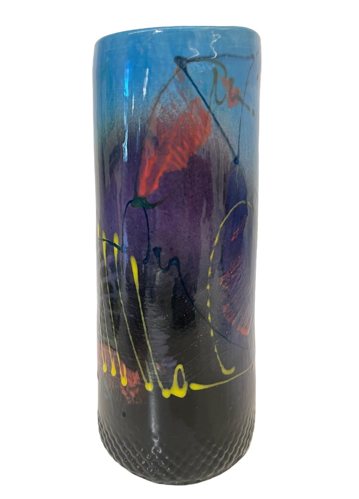 Measures: 6” height x 3.5” diameter

Beautiful signed postmodern vase.