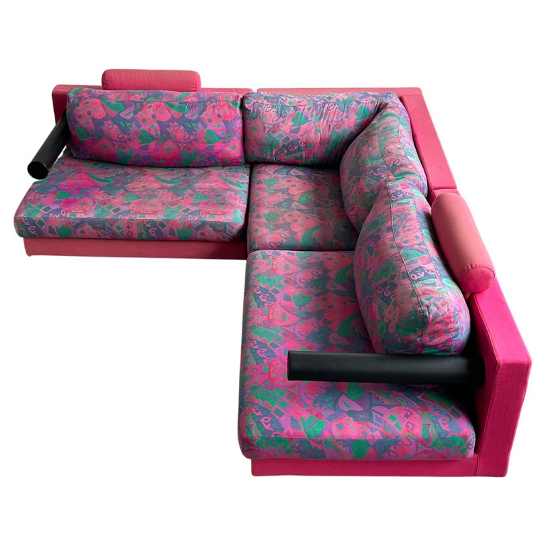 An amazing, rare and early production, three-piece modular Sity sofa designed by Antonio Citterio for B&B Italia. Original upholstery, leather pole armrests, loose back and seat cushions, pink upholstered frames. Original B&B Italia labels.

This