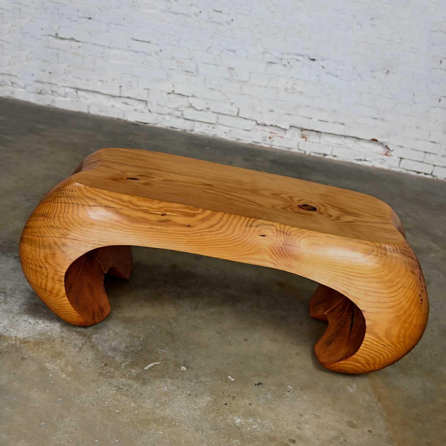 Fabulous postmodern natural sculpted solid pine heartwood bench or coffee table in the style of Carl Gromoll or Wendell Castle. Beautiful condition, keeping in mind that this is vintage and not new so will have signs of use and wear. Please see