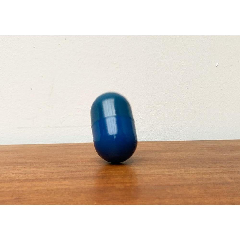 Plastic Postmodern Space Age Deutsche Bank Pill Shaped Balancing Penny Bank, 1970s For Sale