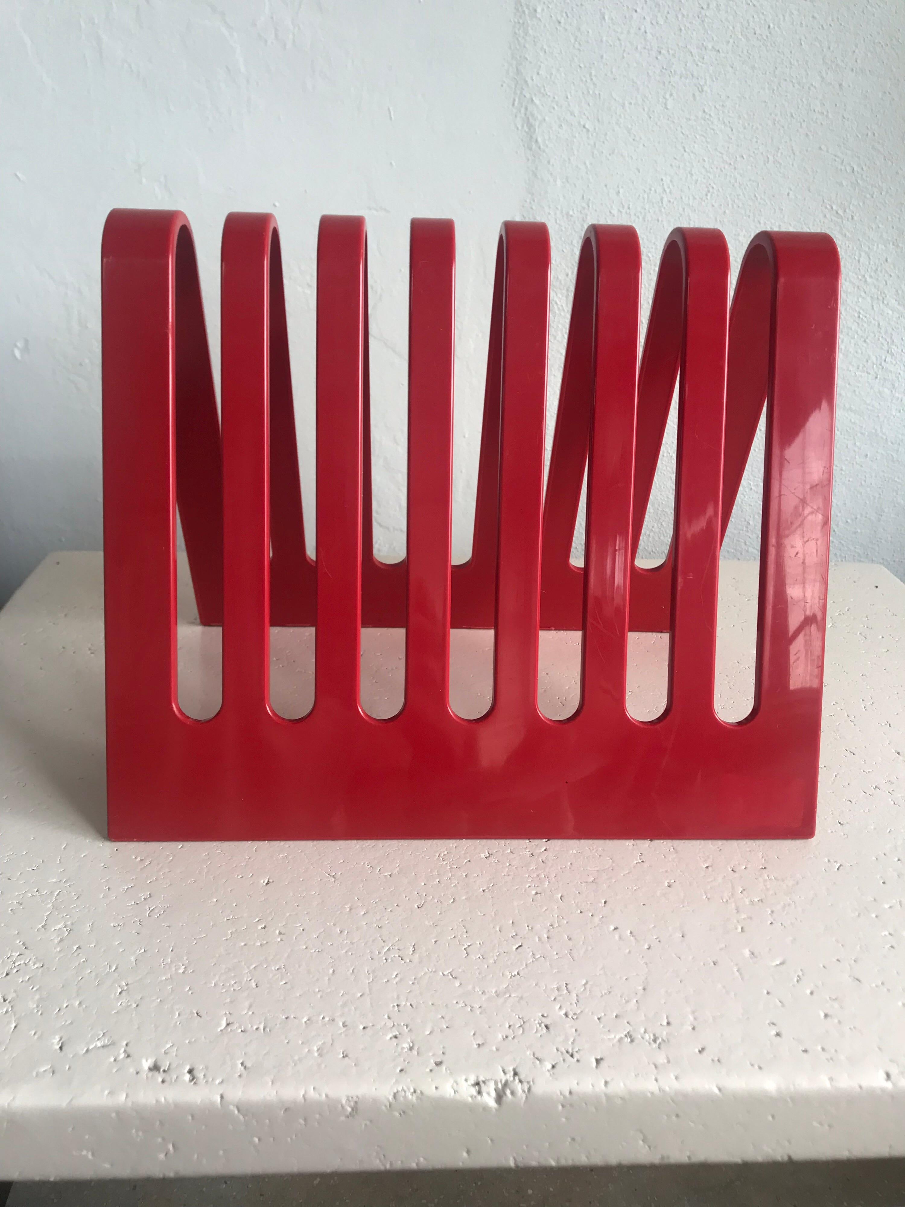 Postmodern magazine rack or file holder rendered in red Lucite plastic plexi designed by Spectrum for Diversified Designs, 1980s.