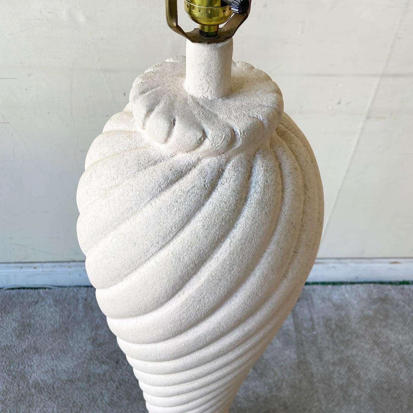 Exceptional vintage Postmodern ceramic floor lamp. Features a sculpted swirl from bottom to top.