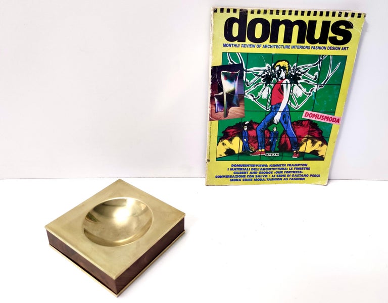 Made in Italy, 1980s.
This ashtray is made in brass and walnut.
It is vintage, therefore it might show slight traces of use, but it can be considered as in excellent original condition.

Measures: 
Width: 14.5 cm
Depth: 14.5 cm 
Height: 4 cm.