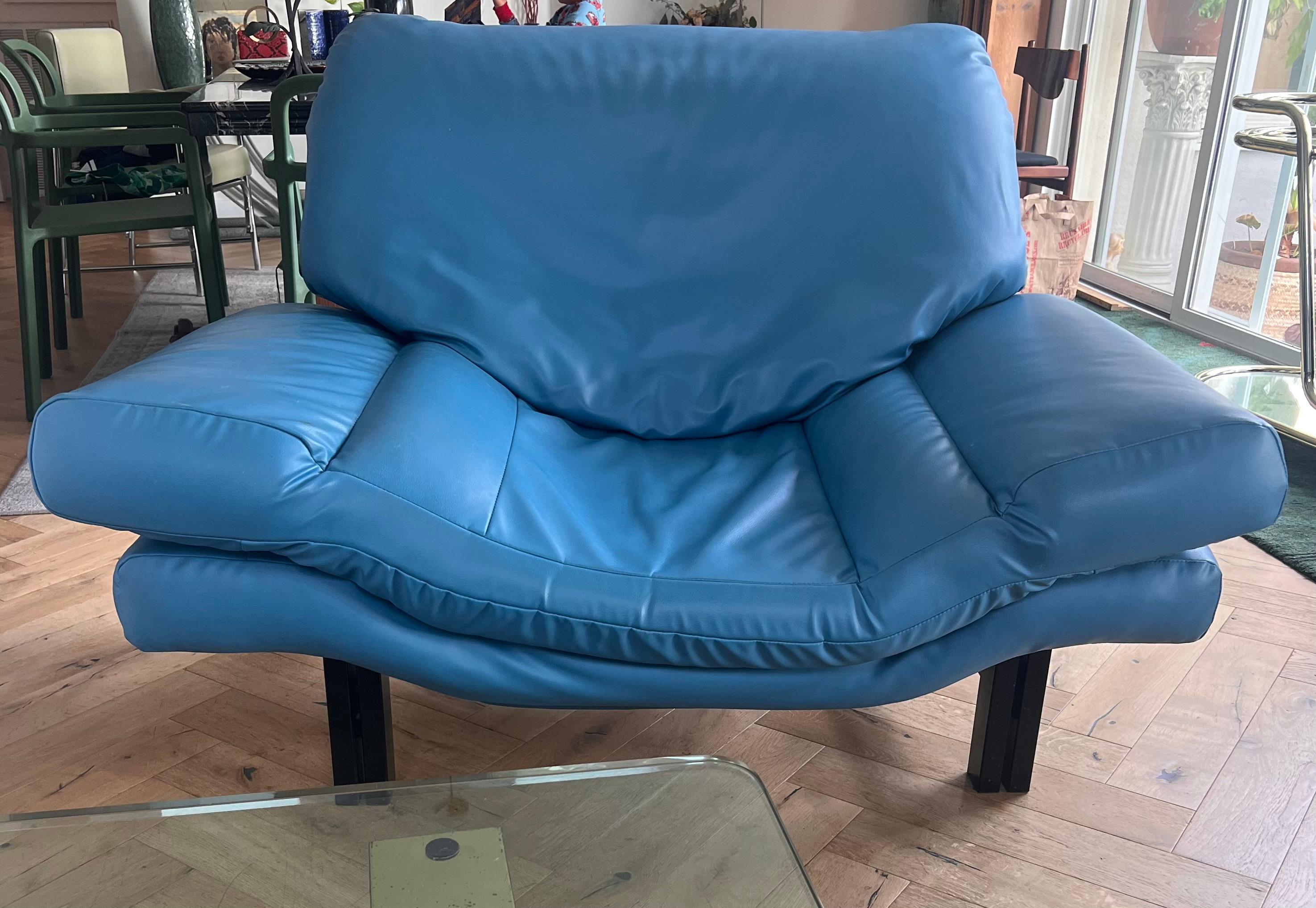 A postmodern lounge club chair in striking cerulean blue faux leather, late 20th century. Possibly by Italian designer Nicoletti Salotti. Black sculptural metal frame. Some wear as shown in photos. Pick up in central west Los Angeles or we ship