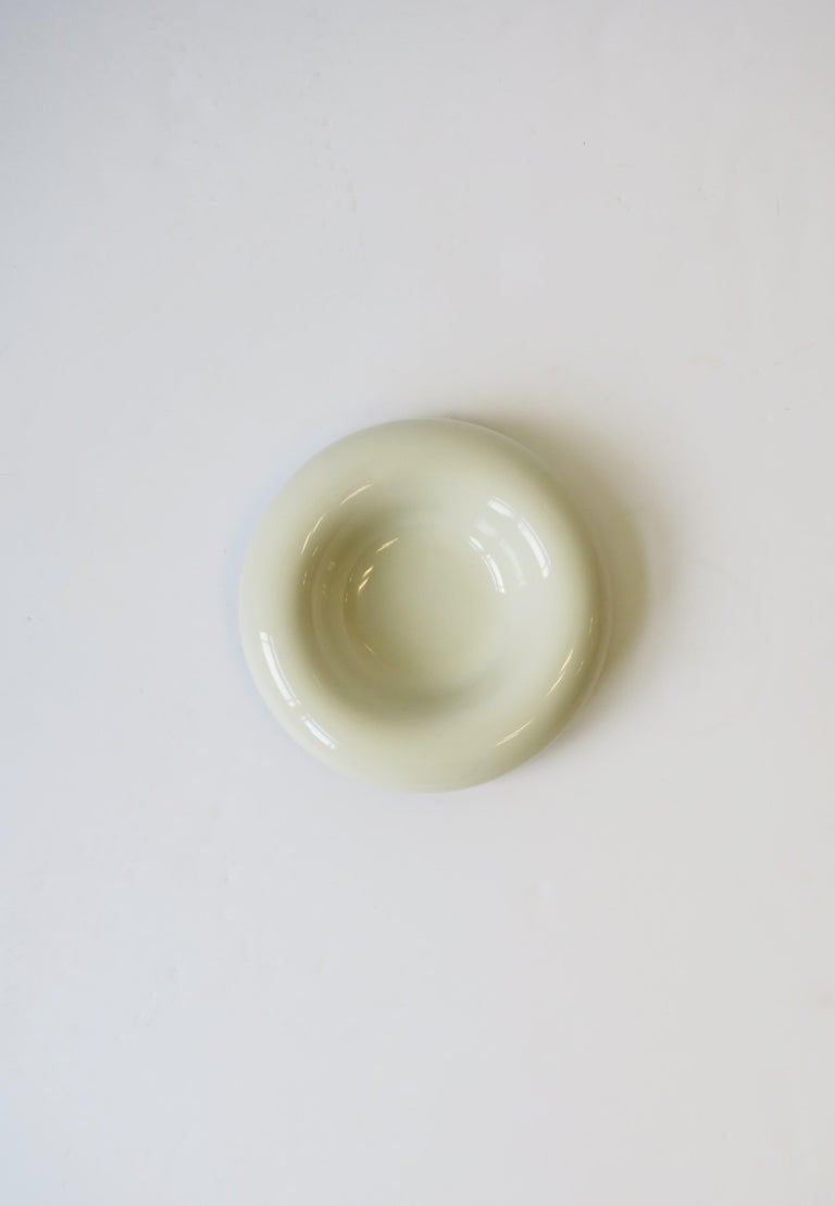 A Modern style or Postmodern period stone white round ceramic bowl, circa 1980s, USA. Maker's mark on bottom as shown in image #15. Dimensions: 7
