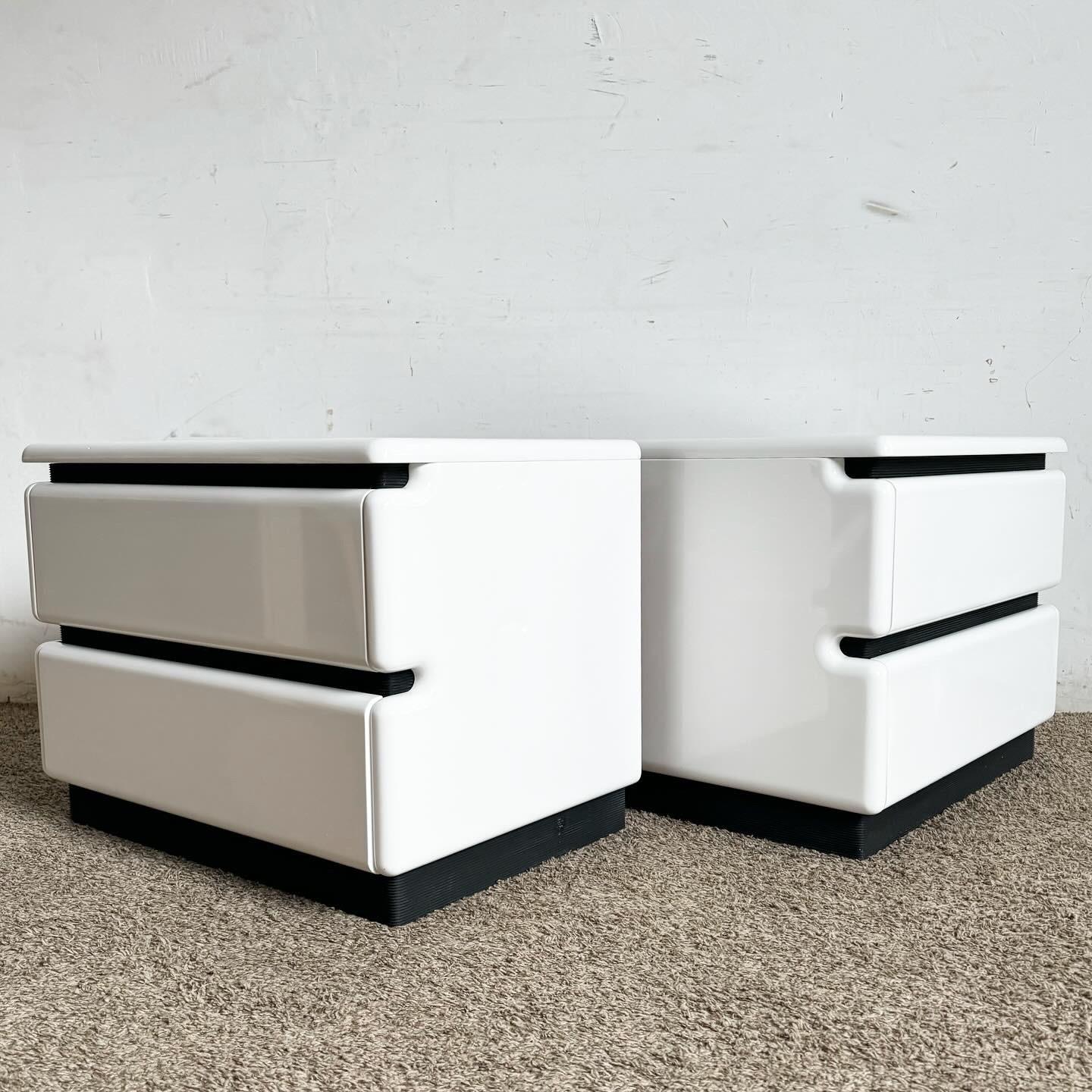 Embrace a futuristic aesthetic with the Storm Trooper Themed Nightstands by Reuben‚Äôs. These postmodern pieces feature a striking white lacquer finish with bold black accents, perfect for modern bedrooms. Offering ample storage and a sleek design,