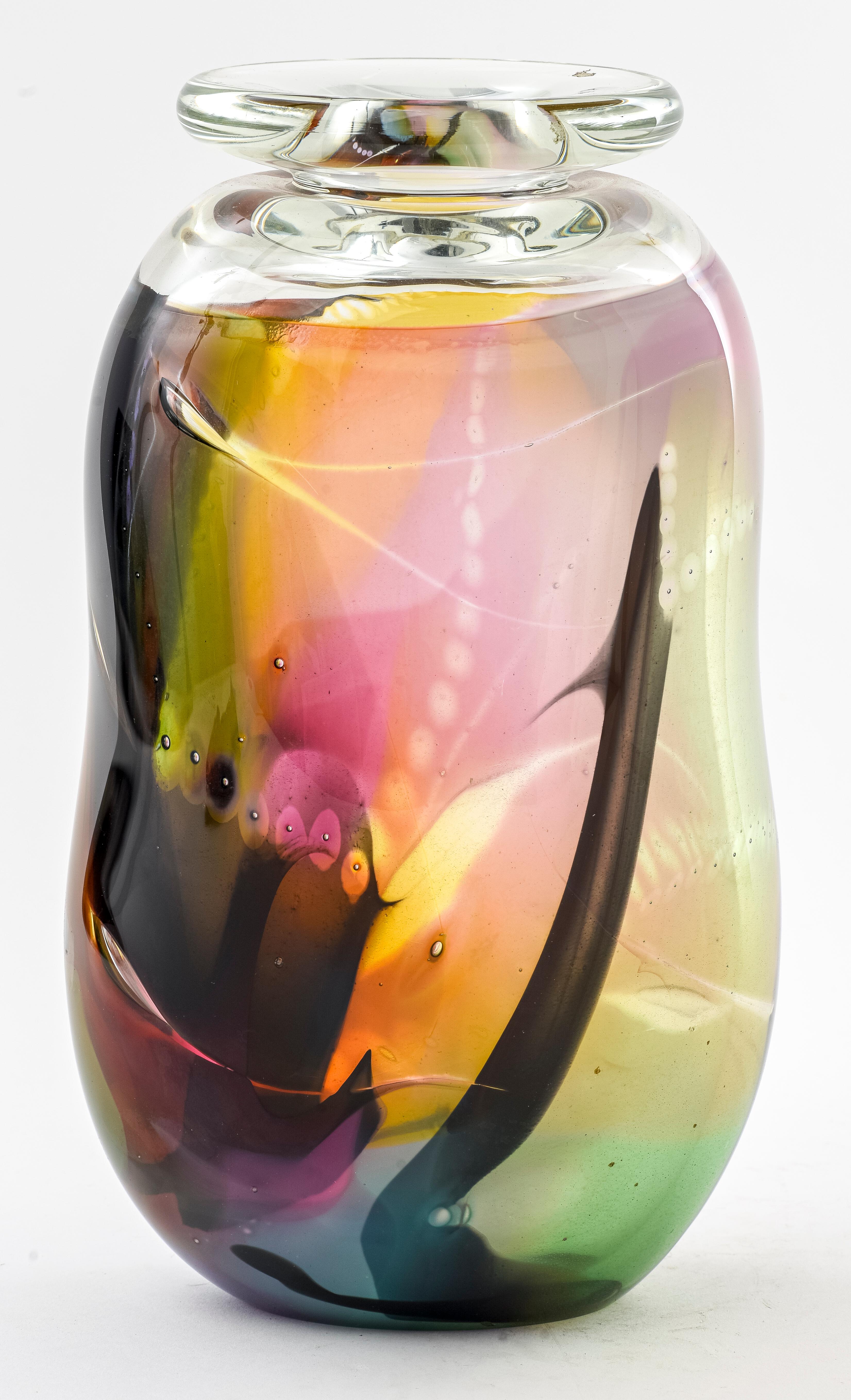 Postmodern studio art glass bottle-shaped vase with abstract motif in multicolored glass, illegibly signed and dated 1980 on the bottom rim. Measures: 11.75