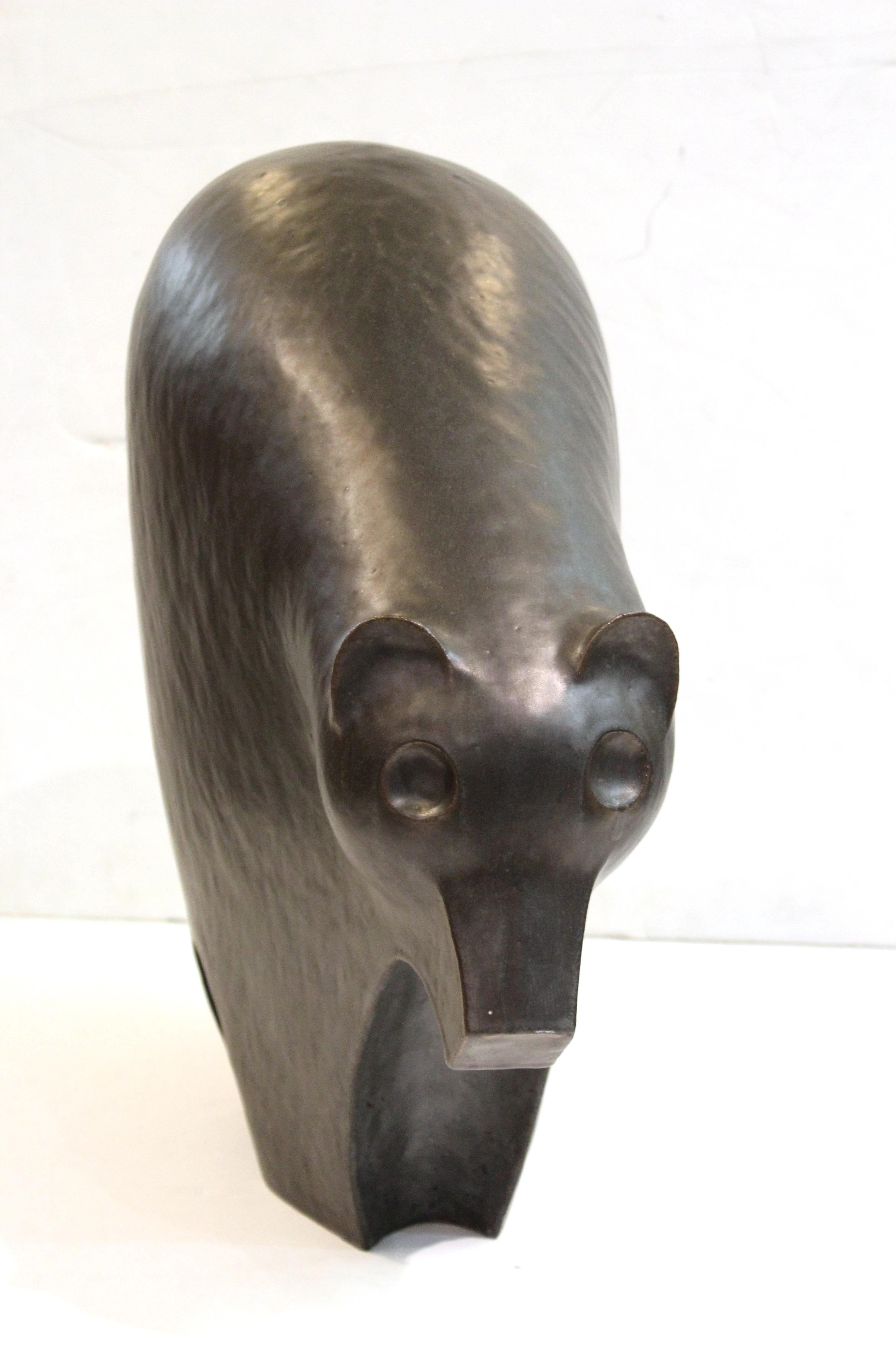 Postmodern studio ceramic animal sculpture of a bear, sculpted by New Mexico artist James Kempes in 1989. The piece is signed and dated on the foot and is in great vintage condition.