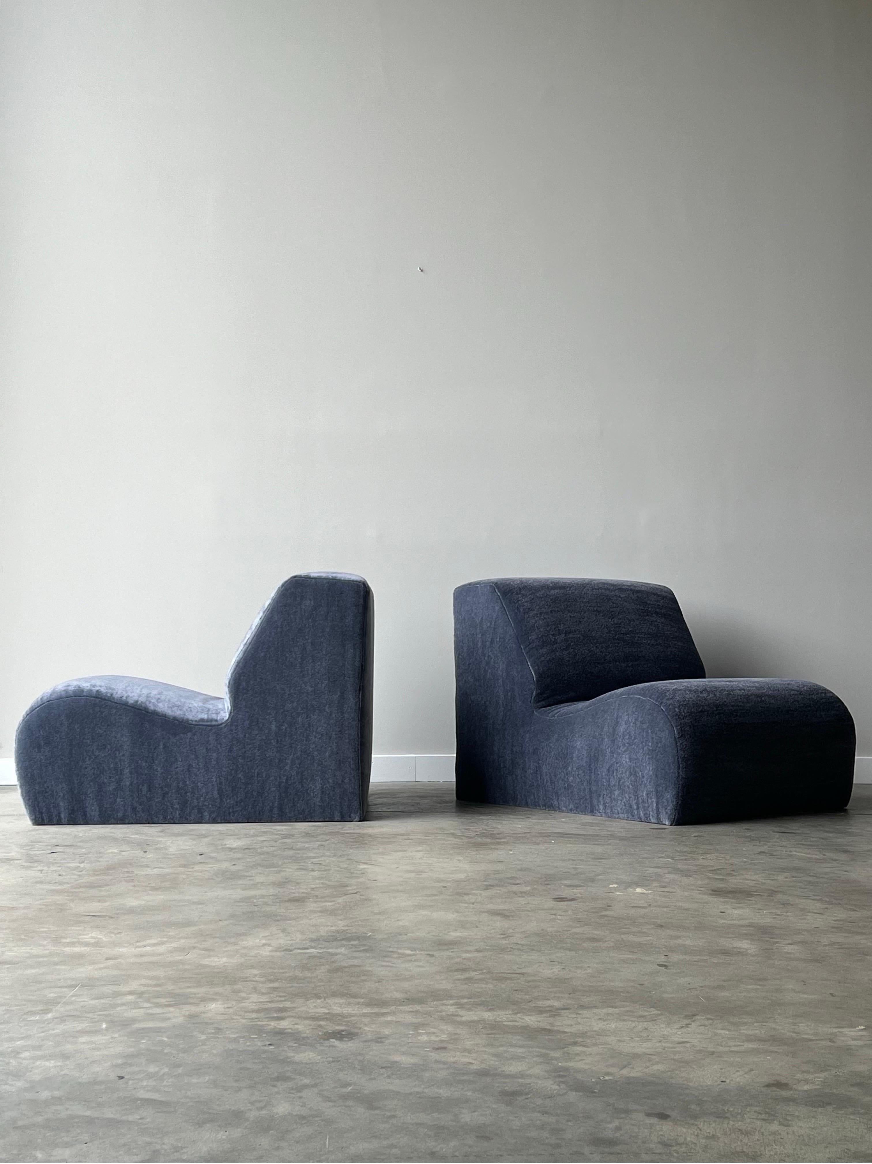 Pair of postmodern style modular lounges. These lounges can be utilized as accent chairs when separated or pushed together to create a loveseat. Made from high density foam which makes them perfectly sturdy yet comfortable. The back of the lounge