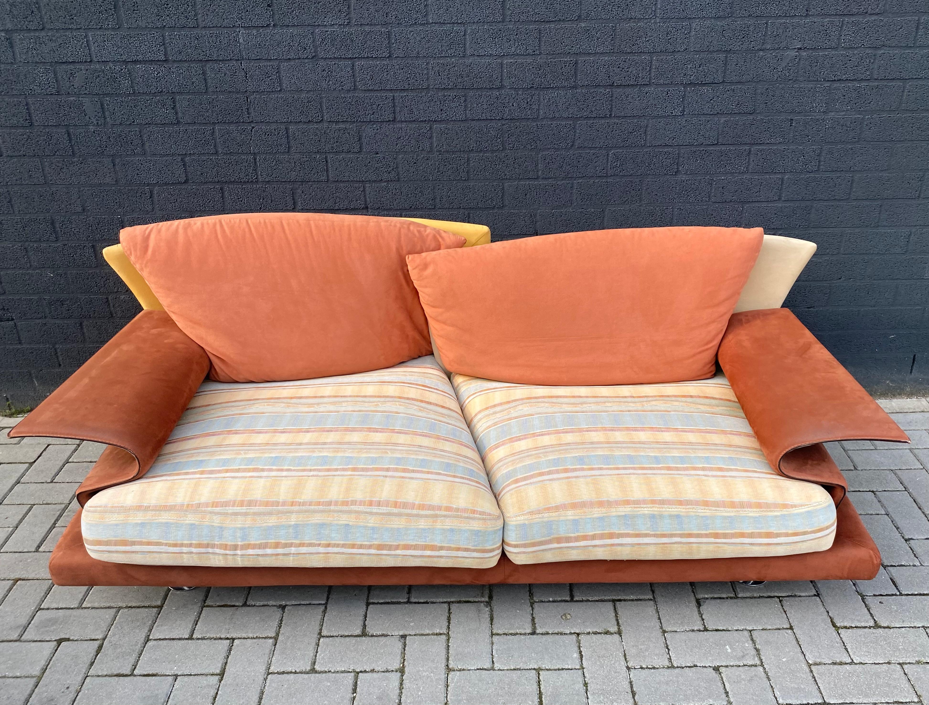 Great Post-Modern Super Roy Sofa with warm Mediterranean colours and soft fabric, designed by Giorgio Saporiti in Ca. The 1980s.
The sofa features a Steel frame, padded with resilient polyurethane foam. Overlapping curved backs which provide two