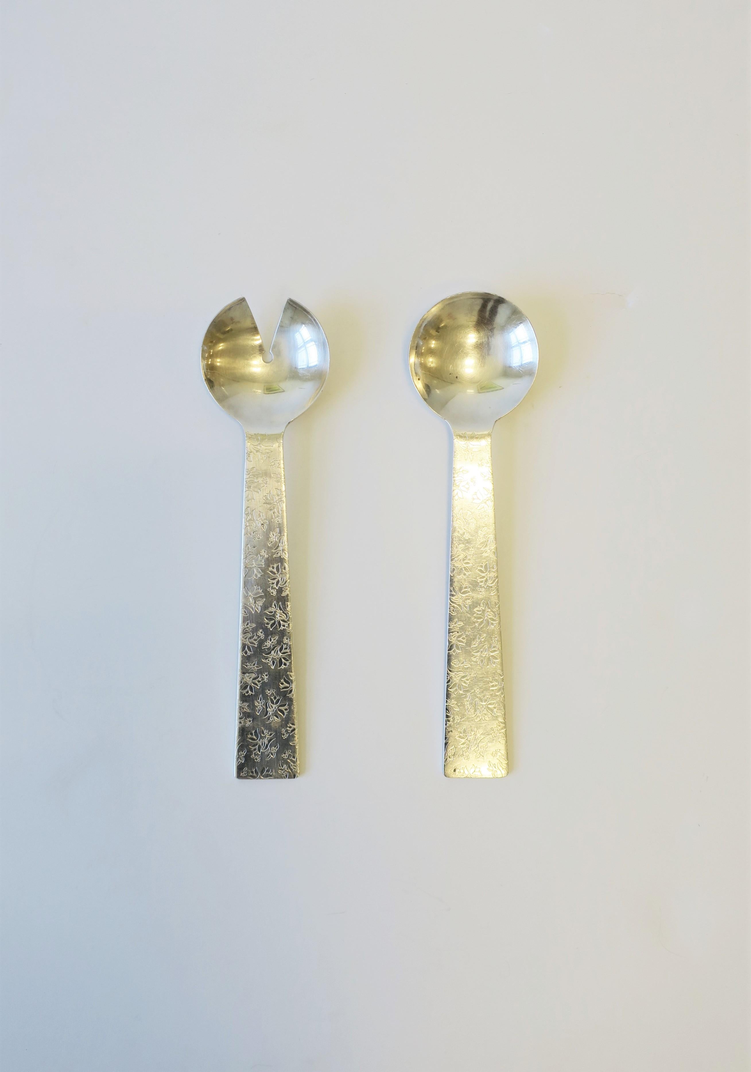 A Postmodern set of sterling silver plate salad serving spoons by Architect and Designer Michael Graves for Swid Powell Co., 1990. Each spoon bears the following on back as shown in images #10, 11 and 12; Marker's marks: Manufacturer, Maker,