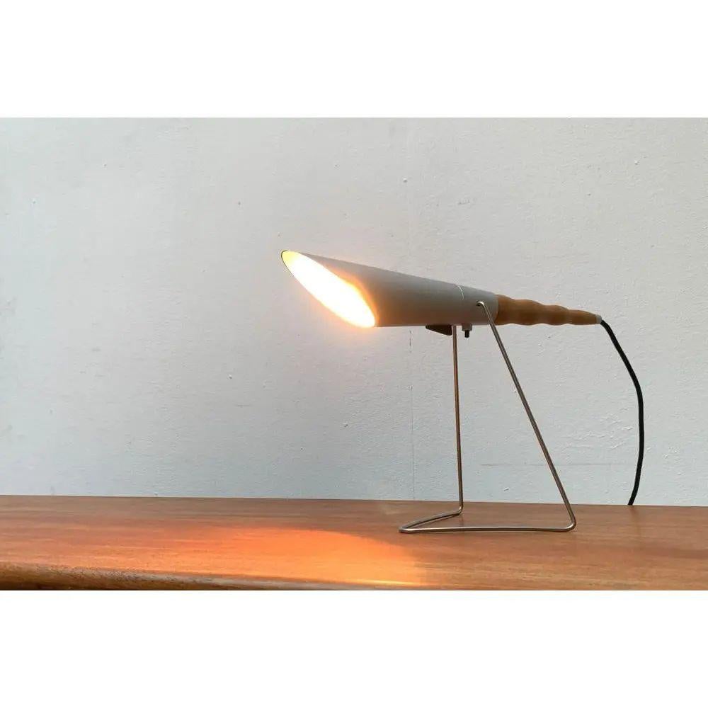 Very rare table or wall lamp from the Swiss manufacturer Belux based on a design by Hannes Wettstein from the early 1990s. Have official proof of authenticity such as vintage catalogs, designer records, or other literature sources for any
