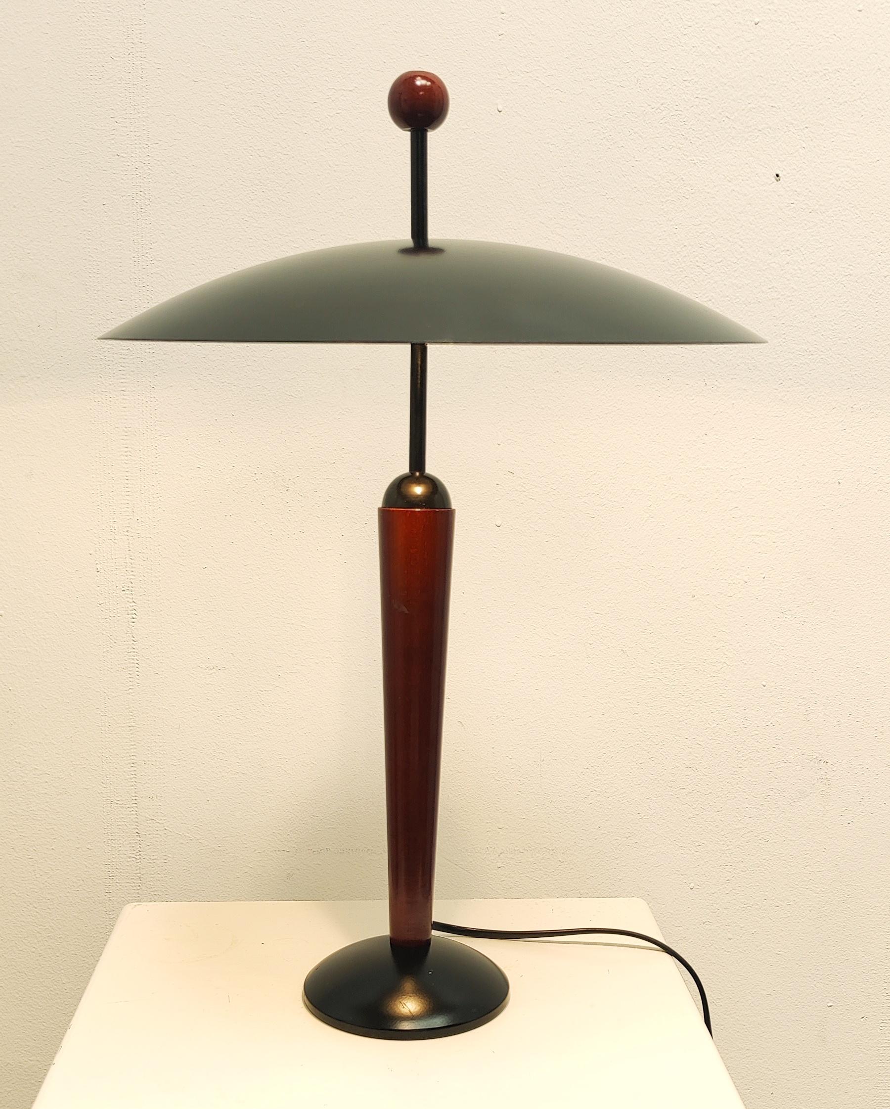 Dutch Design Post-Modern table lamp by Herda, 1980s.

Herda Lighting company, founded 1946 in Amsterdam by the brothers Daniels.
Designers working for Herda , Willem van Oyen sr., Jaap Tiepel, Dirk Heyman and Marga van Dijk. 
The Herda light company