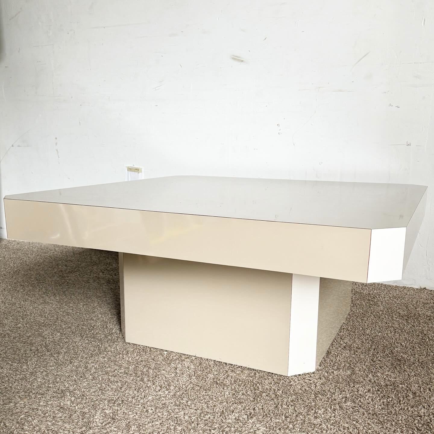 Introducing the Postmodern Tan and White Lacquer Laminate Coffee Table - a perfect blend of functionality and style for modern interiors. This coffee table features a high-quality lacquer finish in tan and white, offering durability and a chic look.