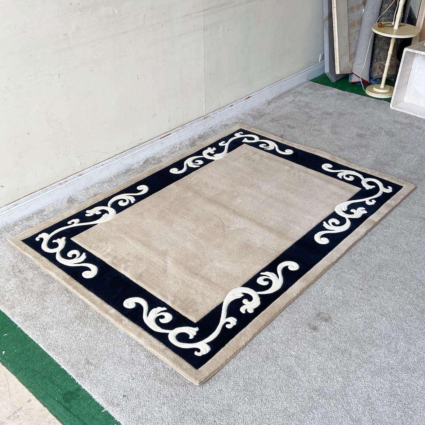 Amazing vintage postmodern rectangular area rug. Features a tan interior with a black border with white vining around within a tan outer edge.

Rug 16
