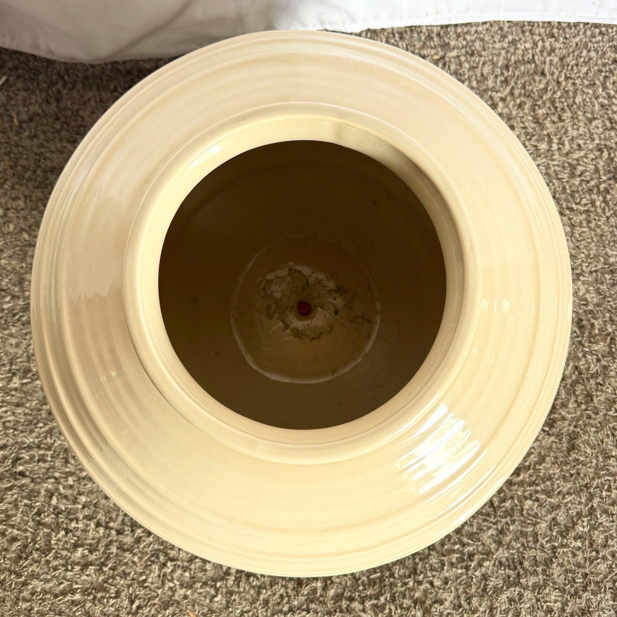 Make a statement with this Postmodern Tan Ceramic Vase—bold ribbed sphere in glossy tan ceramic for sculptural elegance.
 
 We sell items as acquired, without restoring or repairing. Vintage pieces may have age-related wear. Review photos carefully,