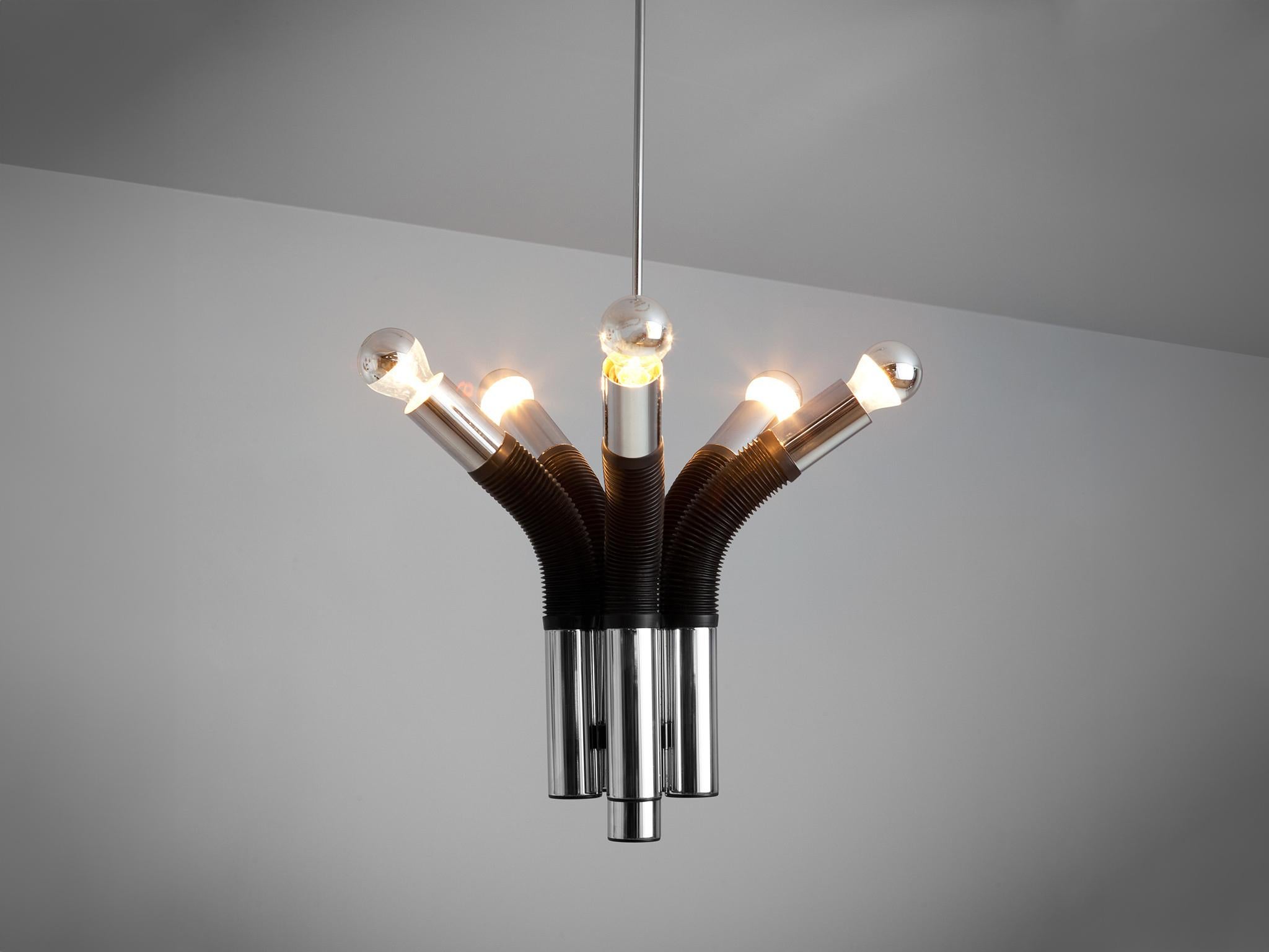 Targetti Sankey chandelier, made in chromed metal and plastic, Italy, 1970s. 

This chandelier made out of five pipes, is a modern way to interpret lighting. With the pipes which present half of rubber body, they open up as if a flower. This