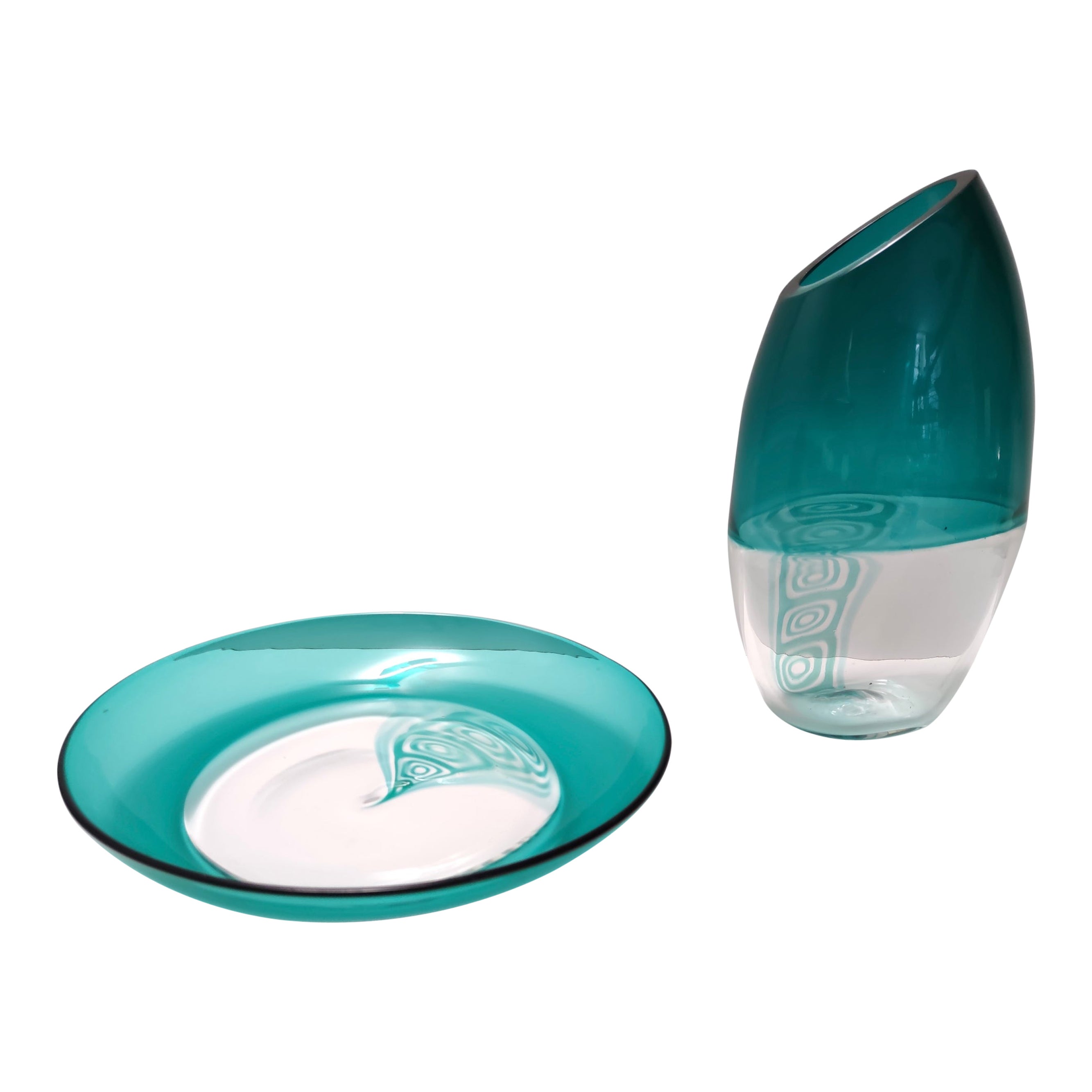 Made in Italy, anni '70-'80.
Sono realizzati in vasi di vetro di Murano con inclusioni di murrine espanse a soffio, 
Sono pezzi d'epoca, quindi possono presentare lievi tracce d'uso, ma possono essere considerati in ottime condizioni originali e