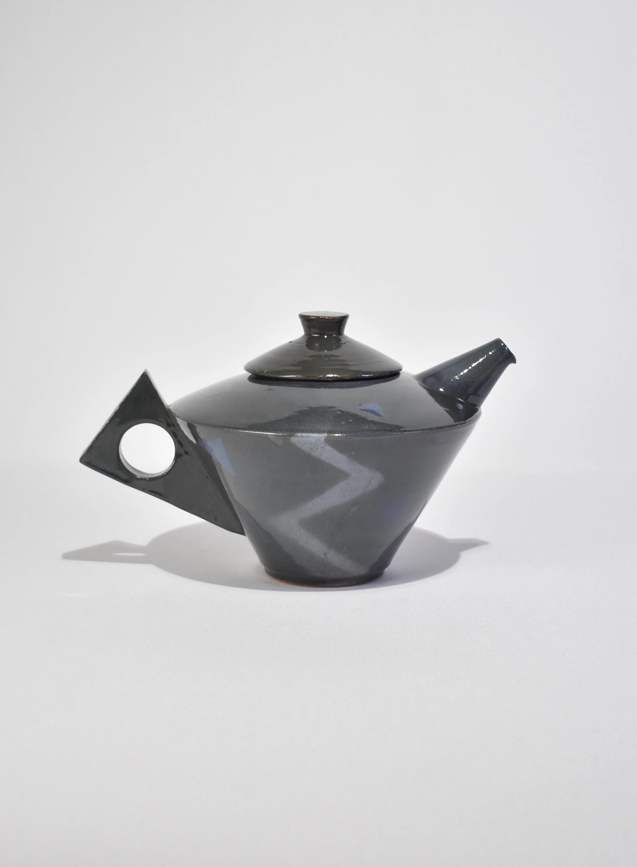 Vintage, handmade postmodern ceramic teapot in slate grey with a sculptural handle. Signed on base.