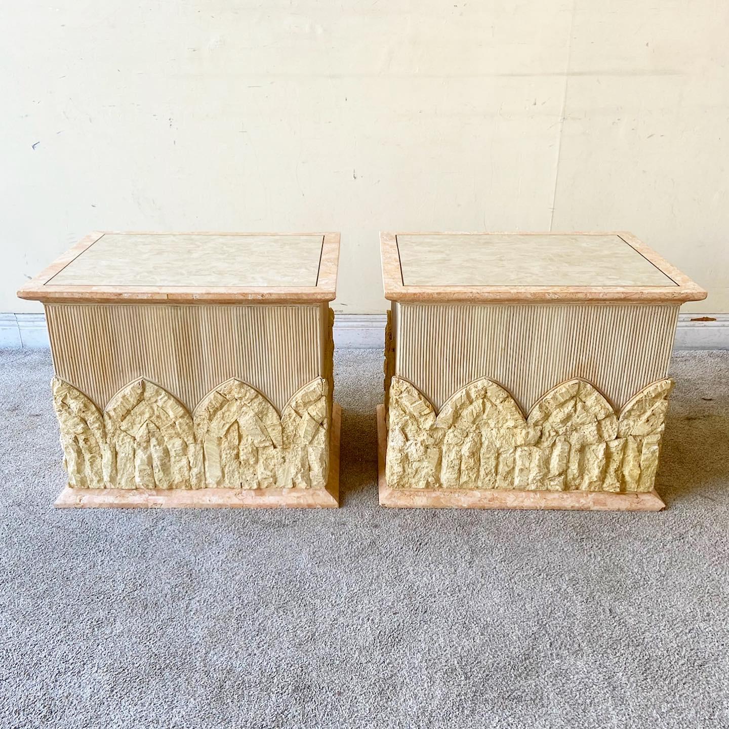 Amazing pair of vintage Postmodern tessellated stone and pencil reed side tables. Each features a pink polished stone around the top and bottom edges. Bothe raw and polished limestone are displayed through the sides and top of the table. The top has