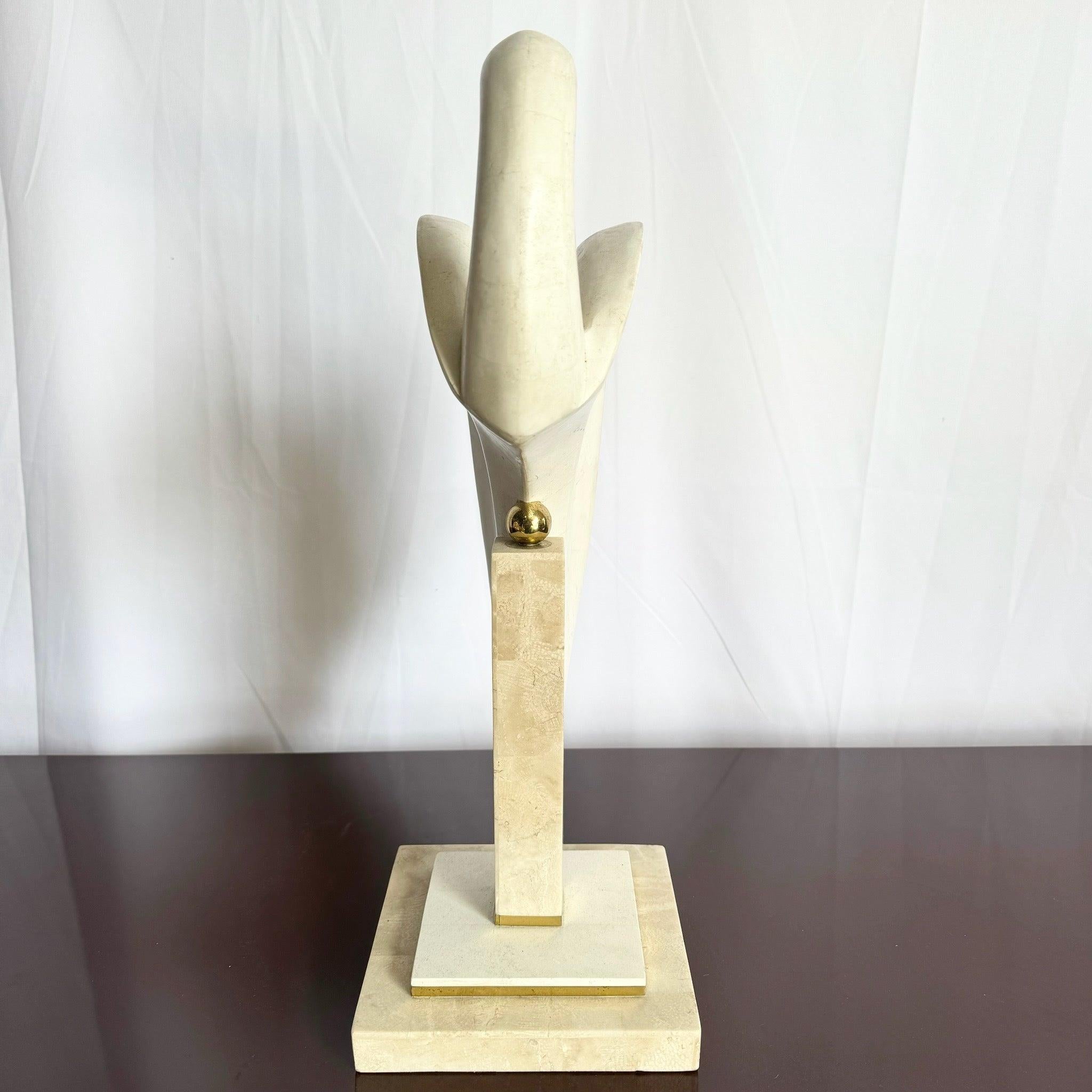 Postmodern Tessellated Stone and Brass Bird Sculpture by Maitland-Smith, featuring a gracefully curved form with brass accents, perfect for elegant interiors.
 
 We sell items as acquired, without restoring or repairing. Vintage pieces may have