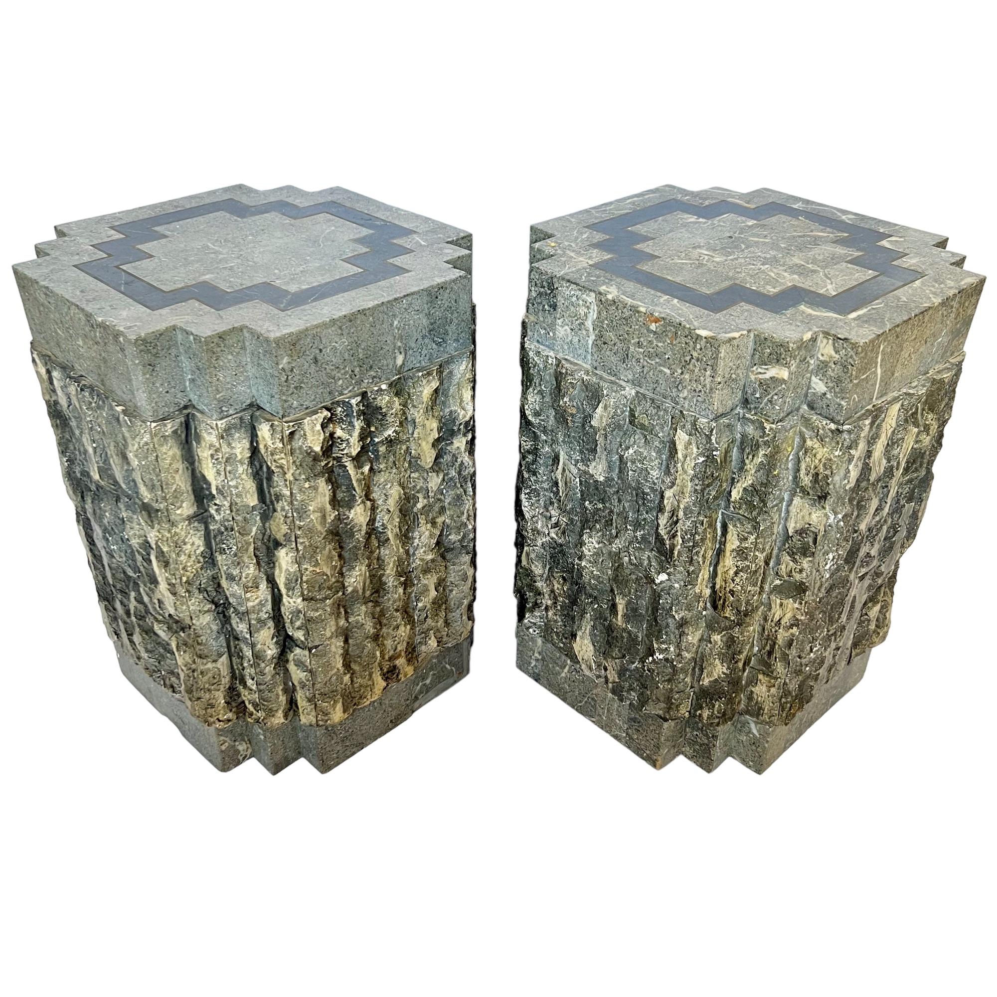 A pair of postmodern tessellated stone pedestal accent tables by Magnussen Presidential circa 1990. Wood frame with polished stone veneered base & top with brass inlay and faux rough stone side panels. They can be used separately or together with a