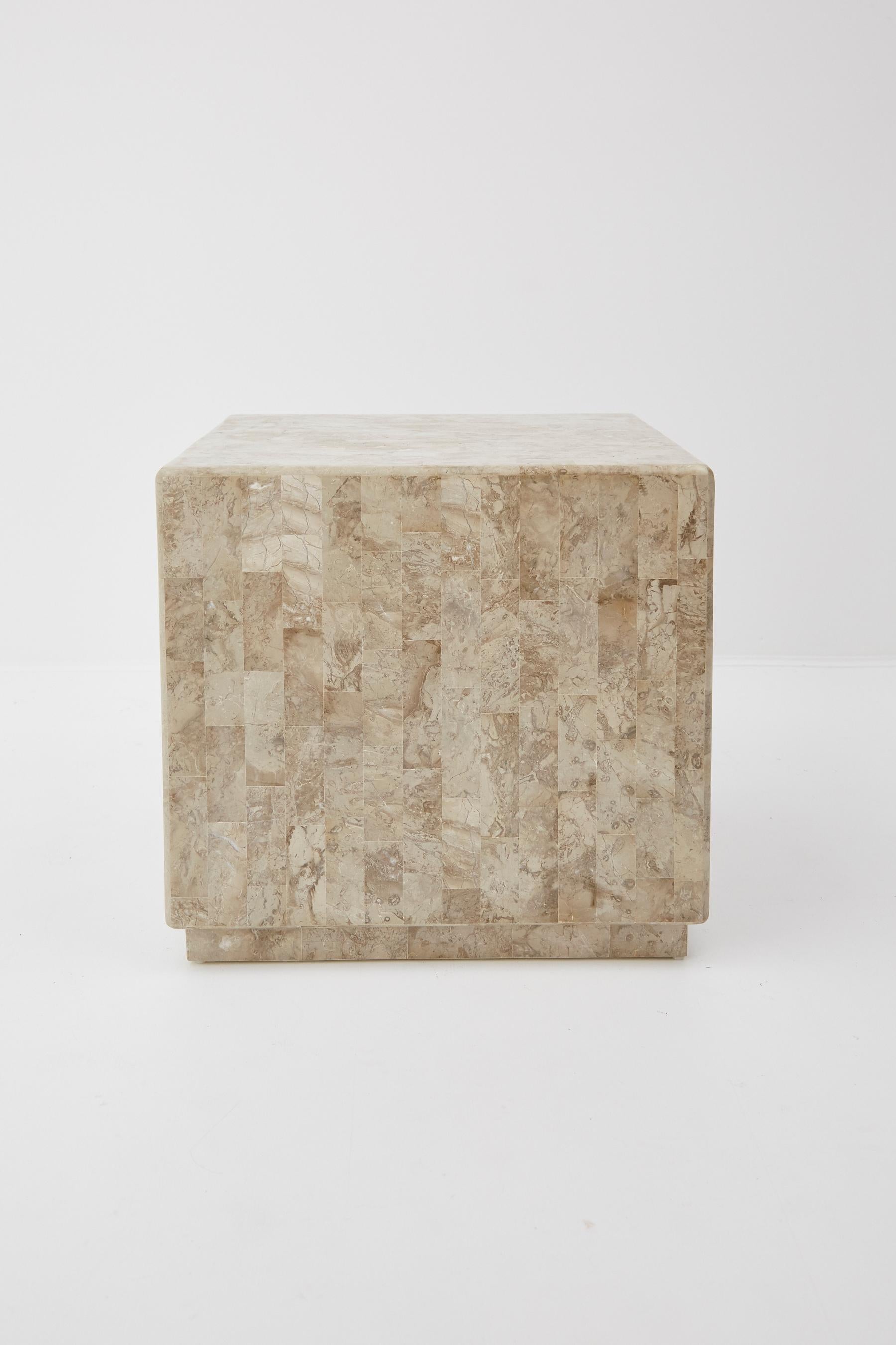 Cube-shaped side table completely covered in natural tessellated cantor stone.

All furnishings are made from 100% natural Fossil Stone or Seashell inlay, carefully hand cut and crafted piece-by-piece and precisely inlaid to the form of the final