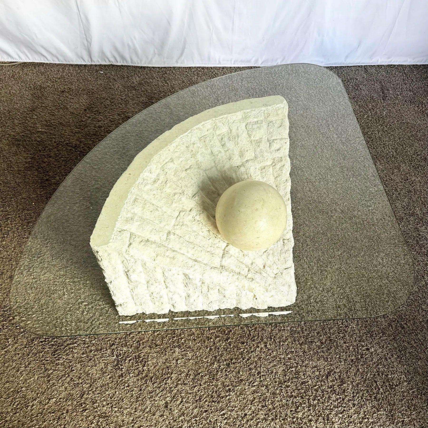 Elevate interiors with this Postmodern Tessellated Stone Coffee Table—triangular glass, textured stone base, and polished sphere.
 

 Table A. We sell items as acquired, without restoring or repairing. Vintage pieces may have age-related wear.