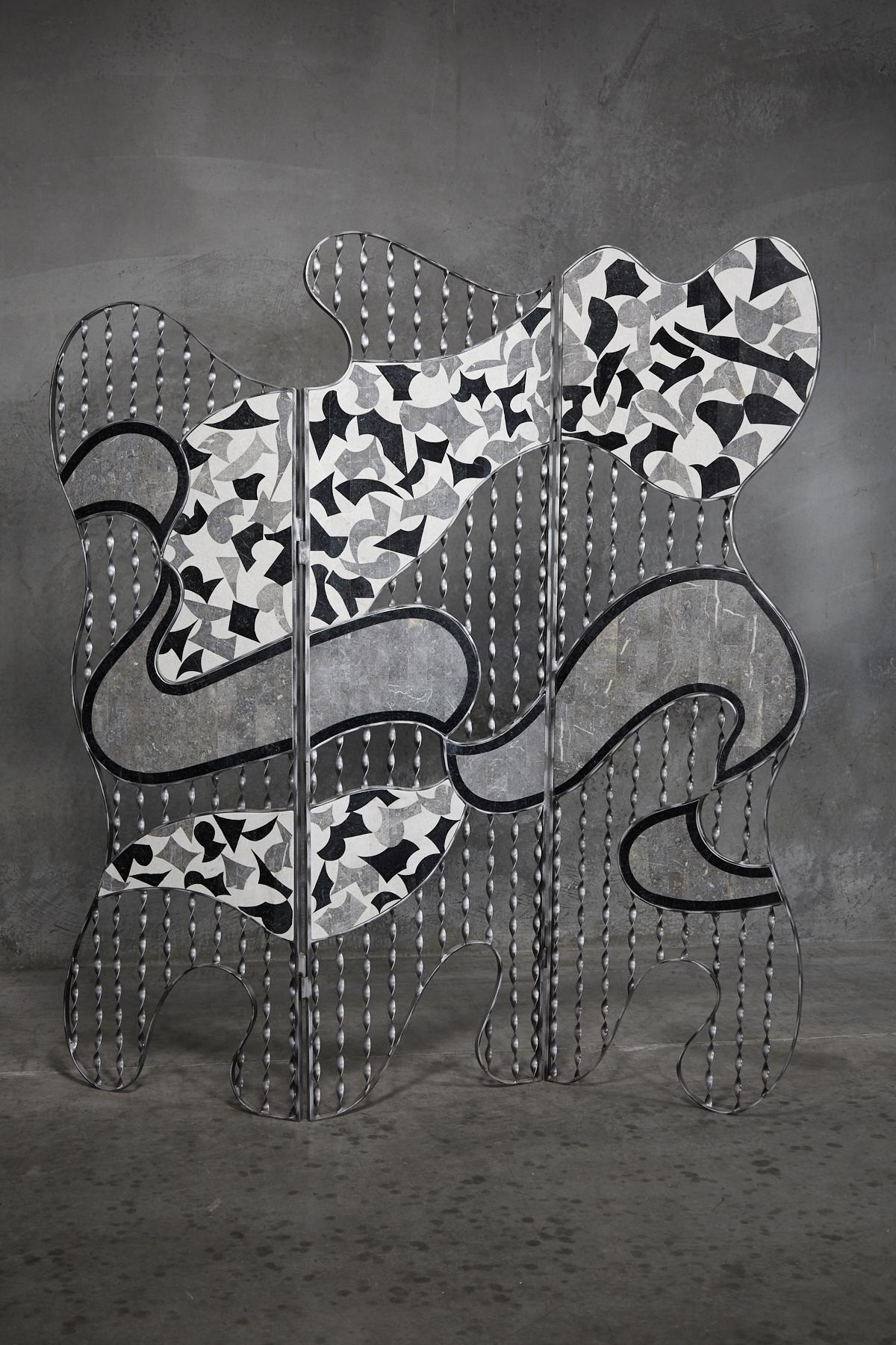 Postmodern three-panel screen with freeform shape, executed in silver toned metal, hand-twisted and partially inlaid with fun black, white and gray tessellated stone patterns.

All furnishings are made from 100% natural Fossil Stone or Seashell