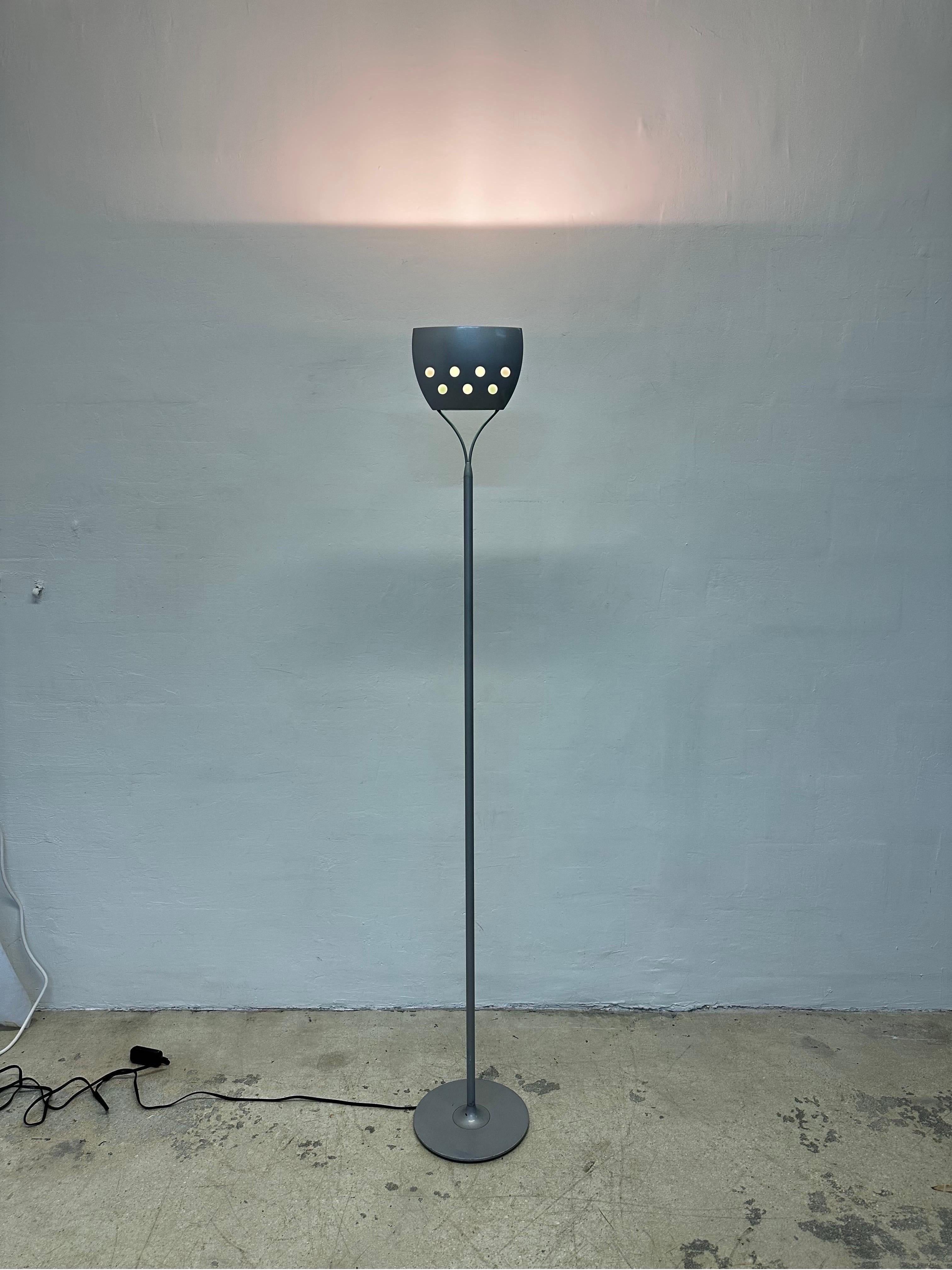 Modern halogen torchiere floor lamp by Perry King and Santiago Miranda for Sirrah Lighting, Italy.  

The halogen lamp bulb can easily be replaced with a more energy efficient and cooler LED bulb.