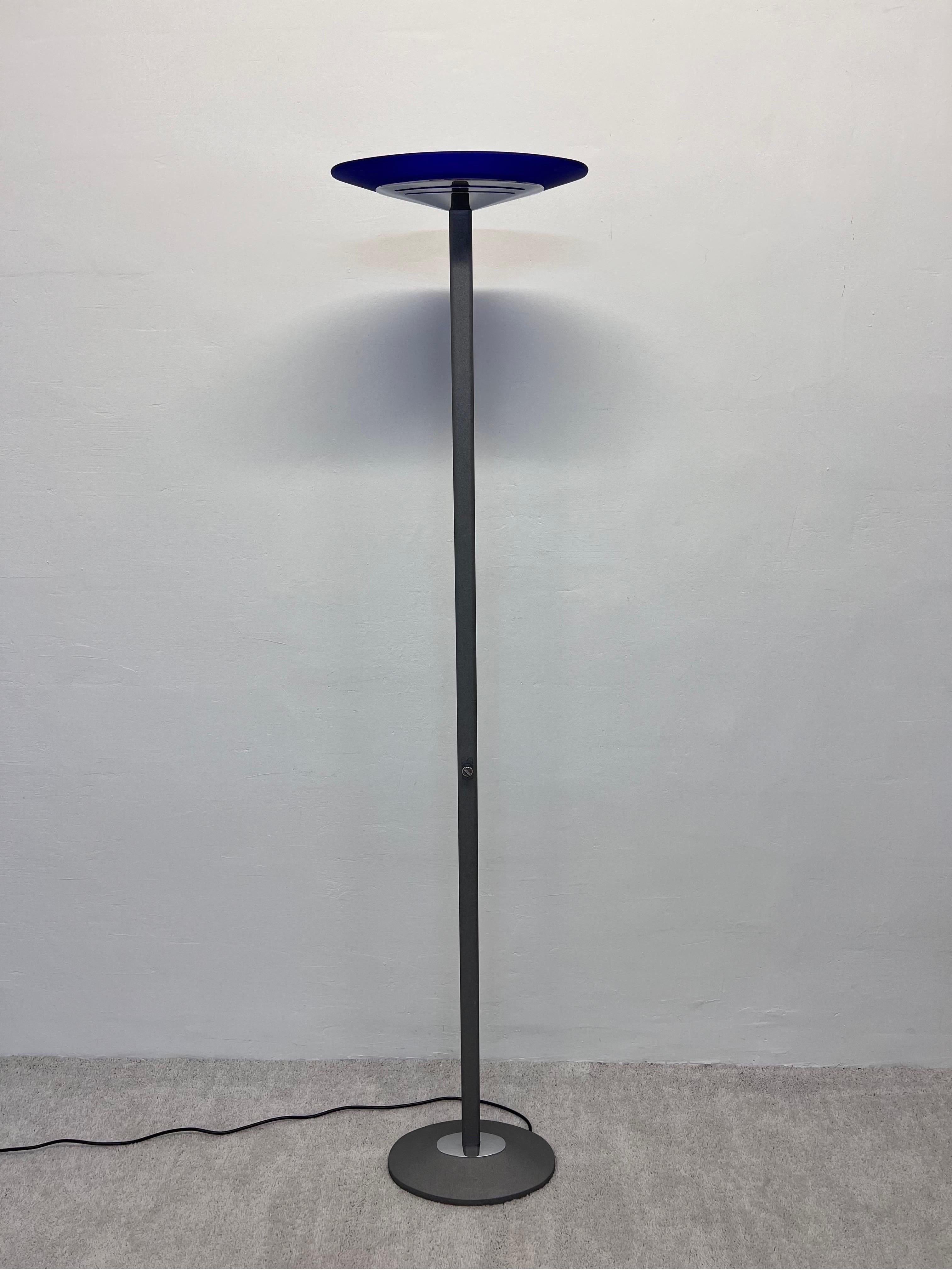 Postmodern dimmable halogen torchiere floor lamp with frosted blue glass and chrome shade attached to a gray textured stem and base by Estiluz, Spain 1990s.

Estiluz is an iconic Spanish lighting company founded in 1969 by Gerard Maseu Jordà.