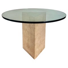 Postmodern triangular limestone and glass circular dining table, late 20th c