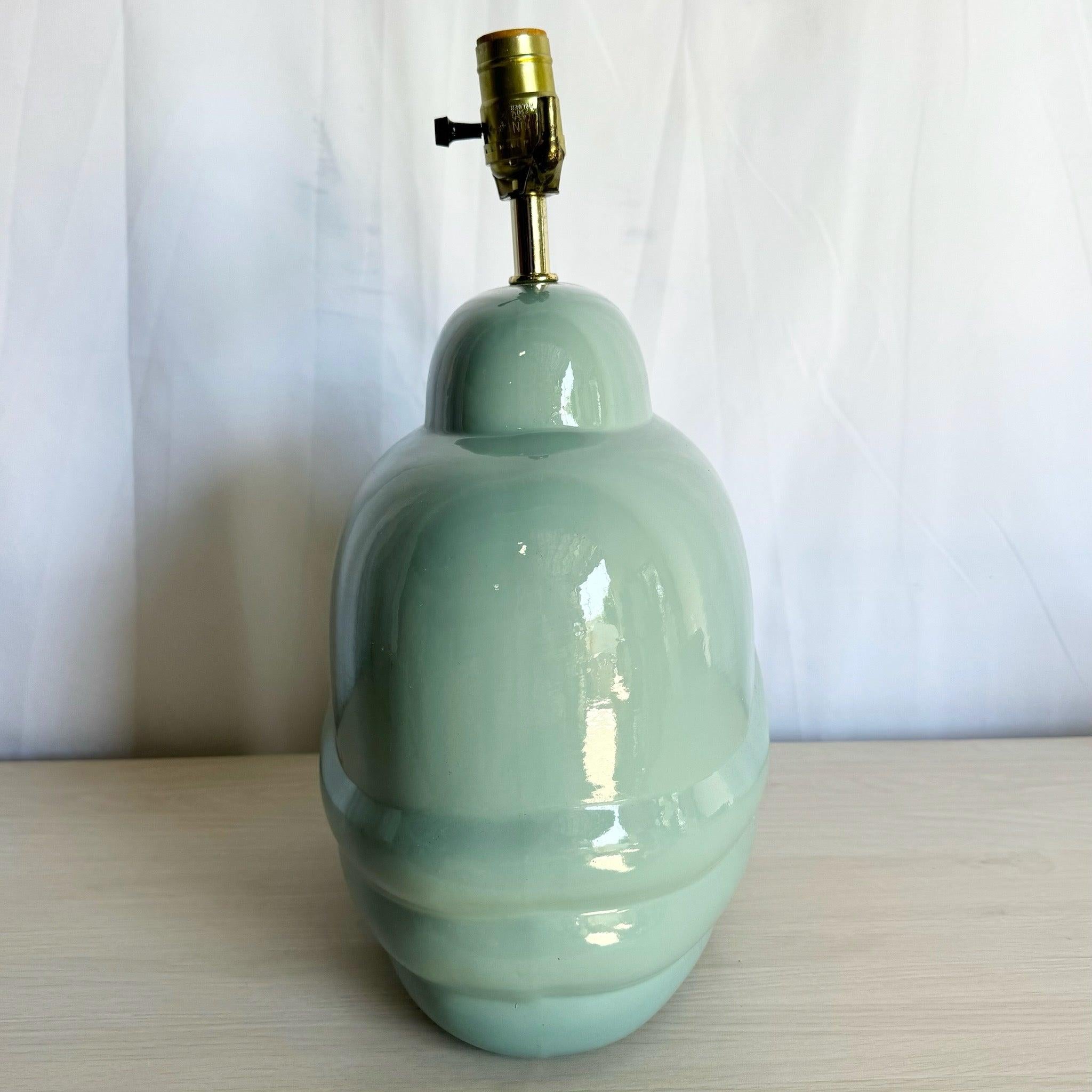 Postmodern turquoise scalloped table lamp with a glossy glaze and sculptural design—perfect for adding an artistic touch to modern or eclectic spaces.
 
 We sell items as acquired, without restoring or repairing. Vintage pieces may have age-related