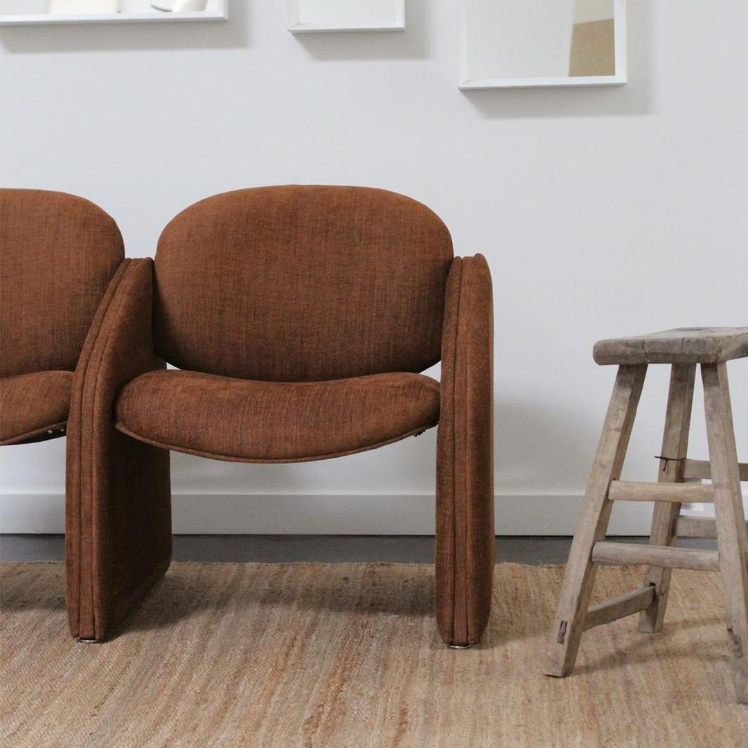 This two seater postmodern bench has been reupholstered in lush, burnt brick Designs of the Time linen, viscose, and cotton blend. Yes, the two 'chairs' are connected!