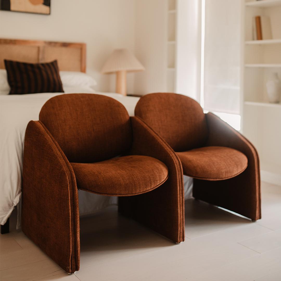 This two seater postmodern bench has been reupholstered in lush, burnt brick Designs of the Time linen, viscose, and cotton blend. Yes, the two 'chairs' are connected!