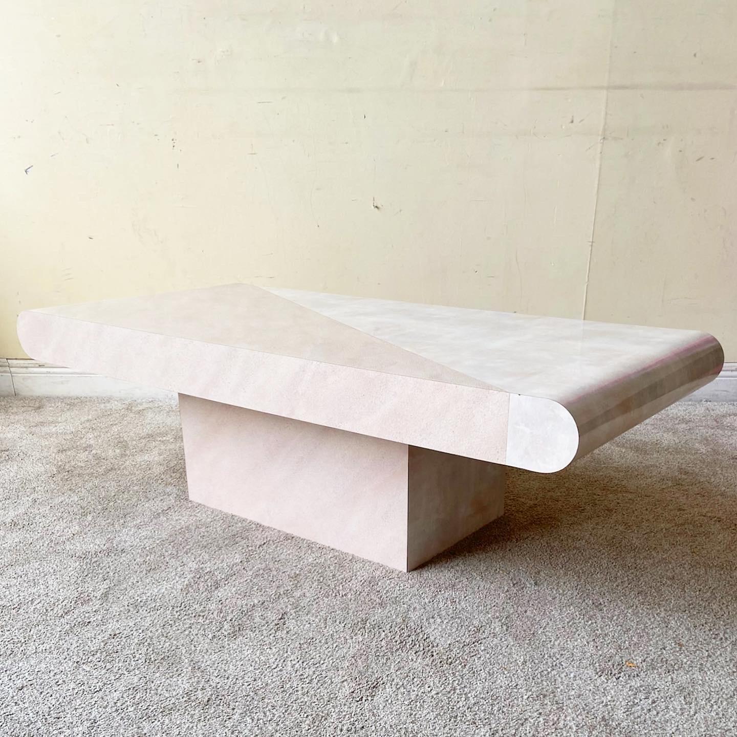Exceptional vintage postmodern two tone bullnose, rectangular coffee table. Half of the table features a pink brushed glossy lacquer laminate with the other half displaying a rough light pink matte laminate.